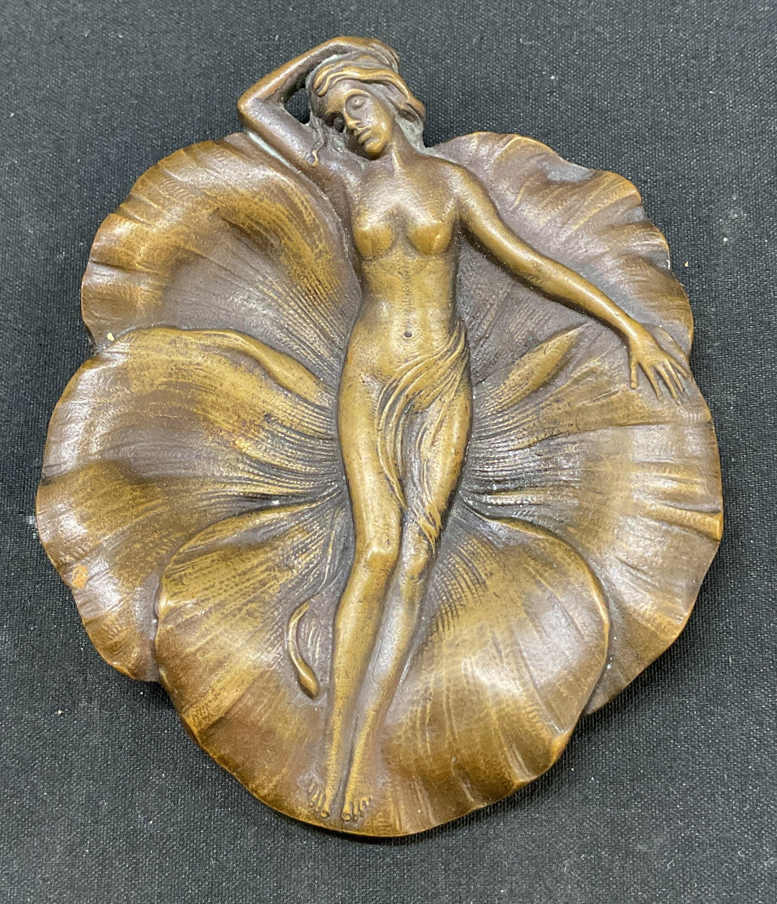 SGND Vintage Cast Bronze Figural Trinket Dish USA: Signed vintage cast bronze figural trinket dish. Signed on surface, reads Cast By Griffoul Newark NJ. Central figure of a woman in a relaxed position. Scalloped edge and detailed surface. Measures