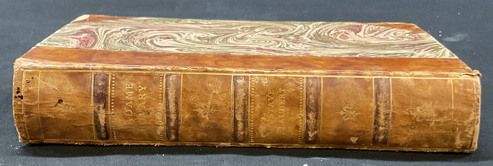 1928 Madame Bovary Book Gustave Flaubert+: Madame Bovary by Gustave Flaubert. Published by Baltiska Forlaget Aktiebolag, 1928. Text reads in Swedish. Hard cover leather bound with embossed gilt trim and marble design. Measures approx 5 x 7.5