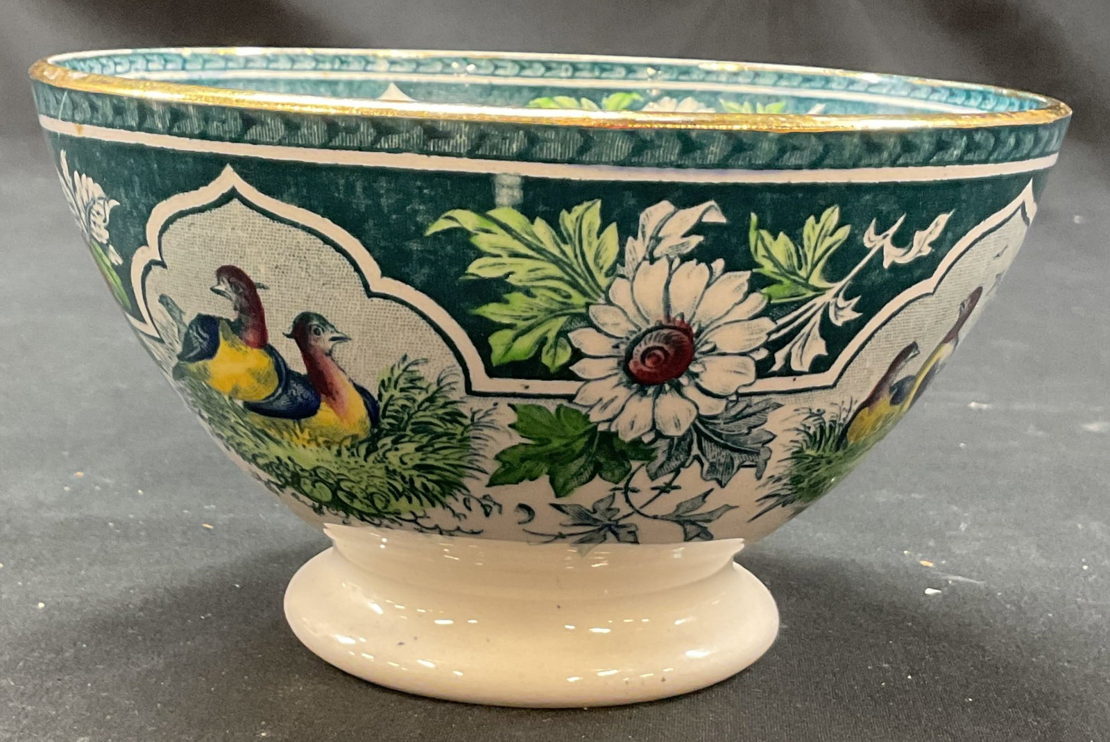Portieux Vallerysthal Porcelain Bird Bowl France: Portieux Vallerysthal porcelain bird bowl. Marked on underside, made in France. Footed base and round bowl. Floral and bird motifs in varying colors. Gilt rim. Measures ht approx 3 inches diam approx