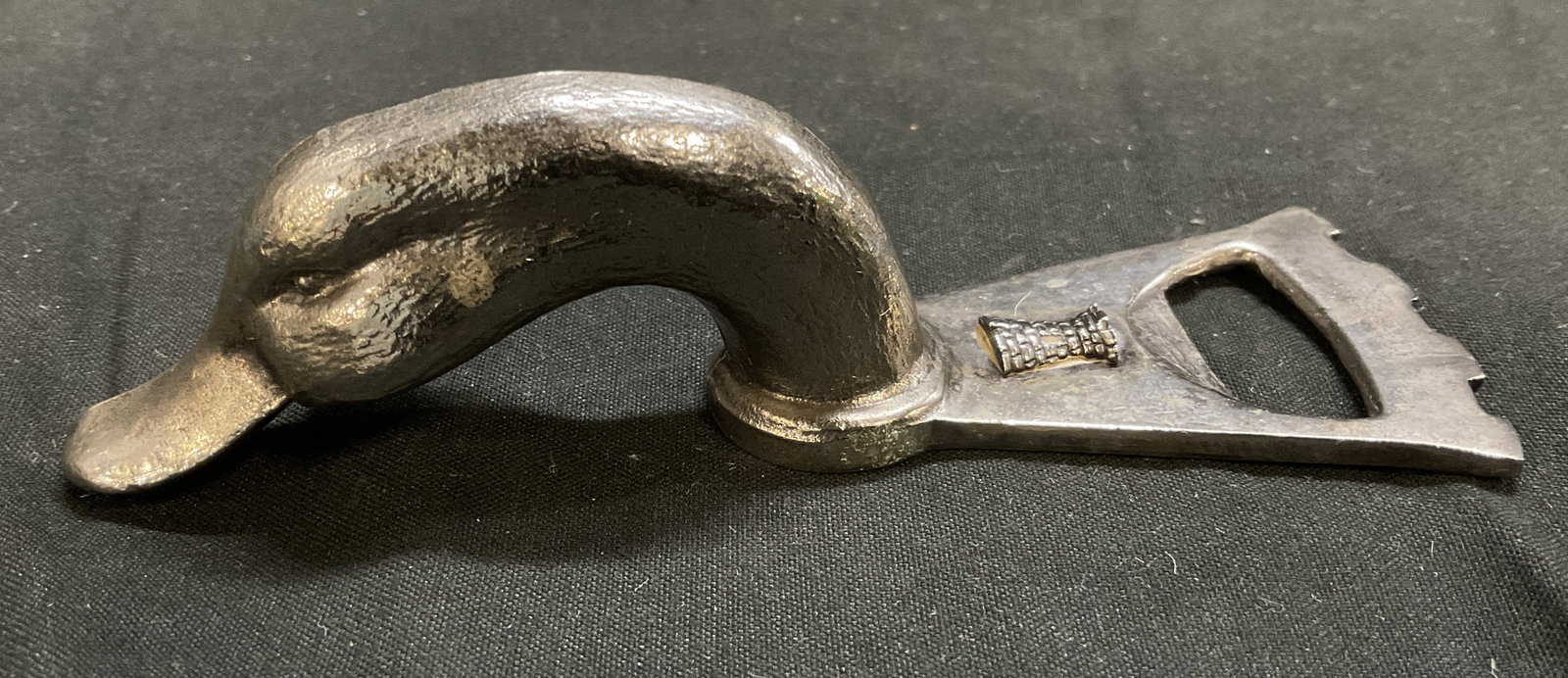VINTAGE Pewter Duck-Head Bottle Opener: Vintage Pewter Duck-Head Bottle Opener. Rectangular Castle-Shaped Cap Lifter with Engraved Small Castle Makers Mark. Scratching and Wear Present. Measures app 1.25in H x 4.5in L. Vintage Bottle