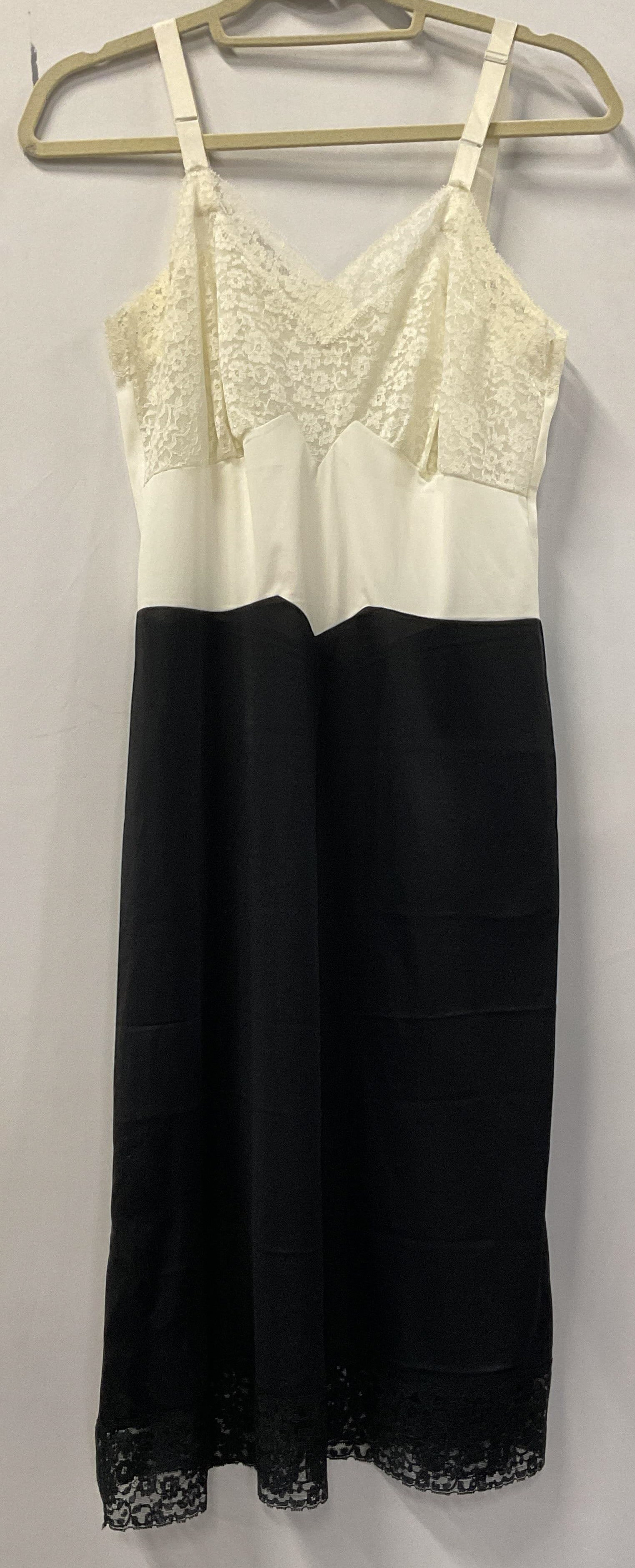 Van Raalte Black & White Lace Slip Dress USA: Van Raalte black and white lace slip dress. Made in USA. Nylon material. Size 33. Lace trim. Wear consistent with exposure, blemishes. Van Raalte, slip dress, night gown, wearables, clothing, fashion.