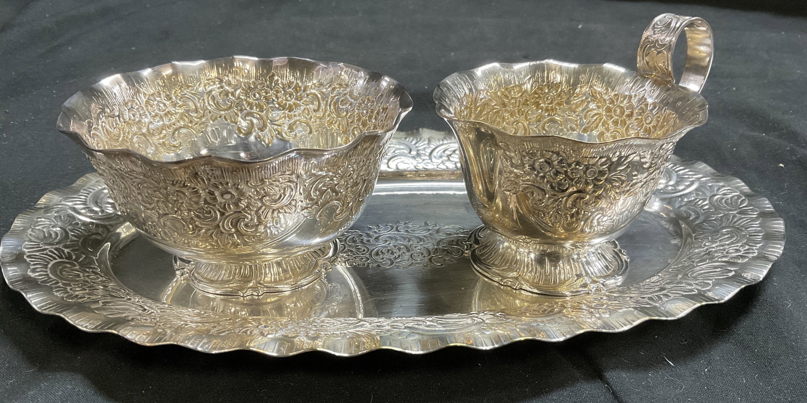 VTG Silver-Plated Amsterdam Patt Coffee Set SWEDEN: Vintage Premium Silver-Plated Amsterdam Pattern Coffee Set. Made in Sweden. Marked Prima NS. 3 Pieces. Includes Creamer Dish, Sugar Bowl, and Tray. Textured Floral Relief Wrapping. Ruffled Edges.