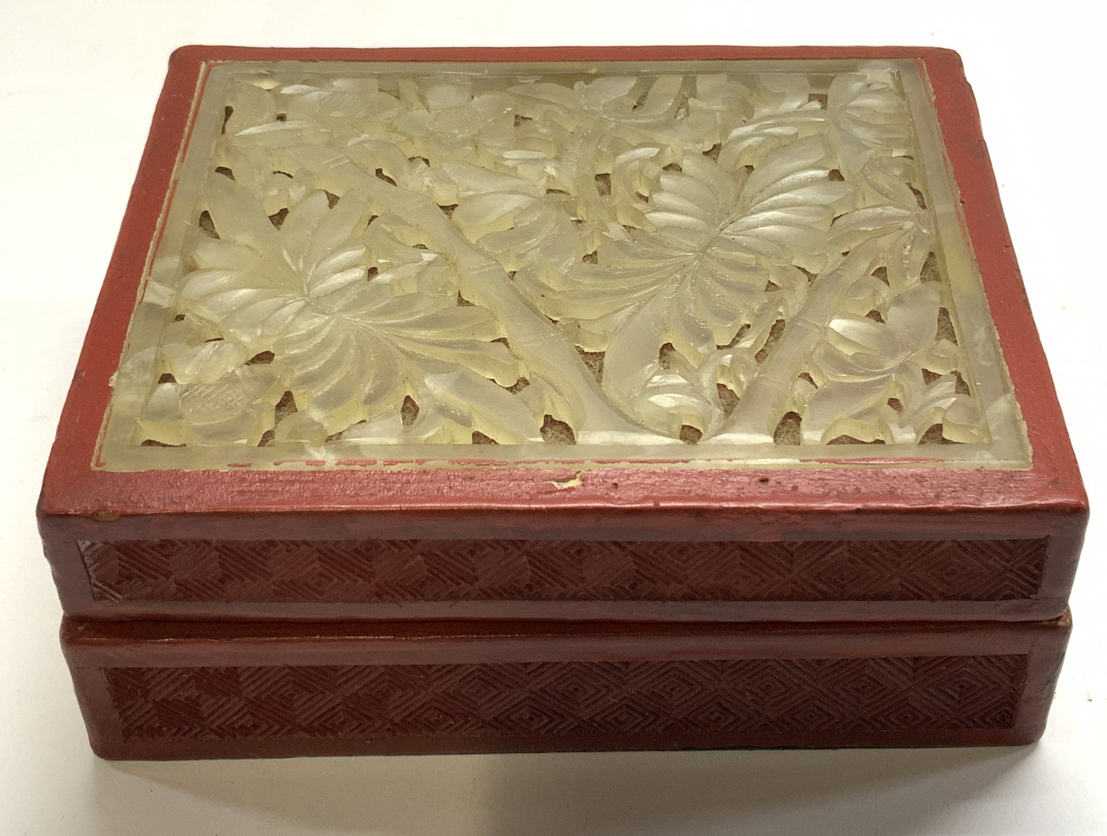 Antq Chinese Cinnabar Lacquer Jade Trinket Box: Antique Chinese Cinnabar Red Lacquer Trinket box with carved Jade plaque inset lid. Fitted lid with translucent carved panel hand carved Jade with open work patterns of florals, bamboo, and other foli
