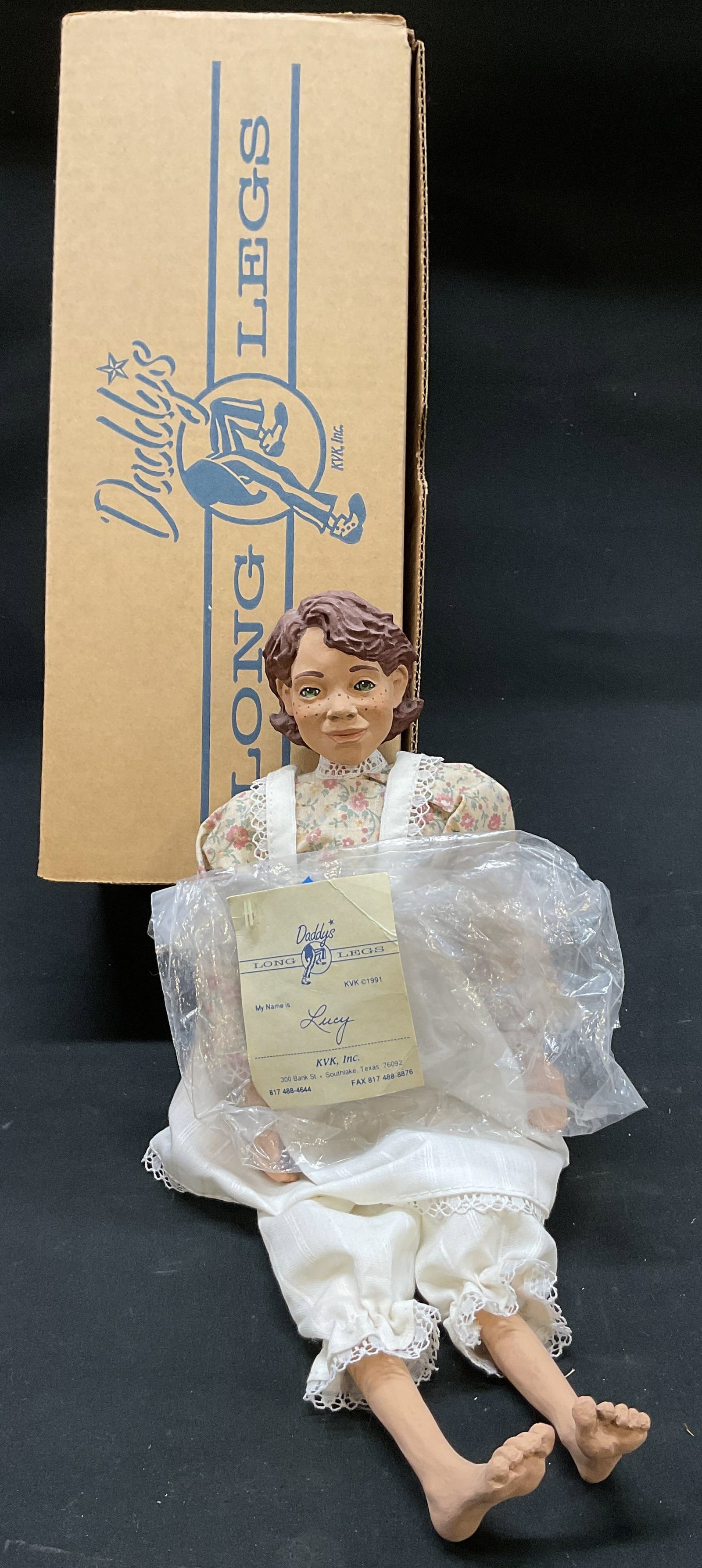 Vtg. 1991 Daddys Long Legs Lucy Doll IOB/COA: Vintage 1991 Daddys Long Legs Lucy Doll KVK Inc. Signed Hanging ID tag in original Box with Certificate of authenticity. USA. Designed by Karen Germany. Lucy- freckles, green eyes, auburn hair. Countr