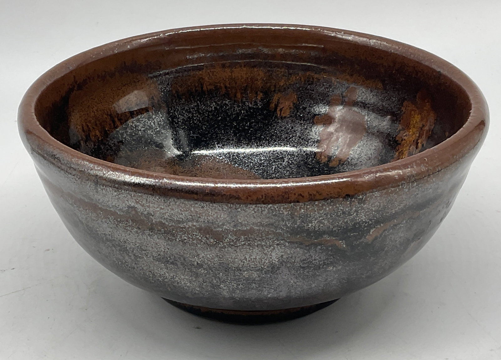 SIGNED Turkel Metallic Glaze Studio Pottery Bowl: Signed Turkel Handmade Studio Pottery Bowl. Metallic Chocolate Brown and Black Swirled Glaze. Condition Consistent With Exposure. Measures app 3in H x 7in Diam. Signed Pottery Bowl, Artisans, Drip Gla