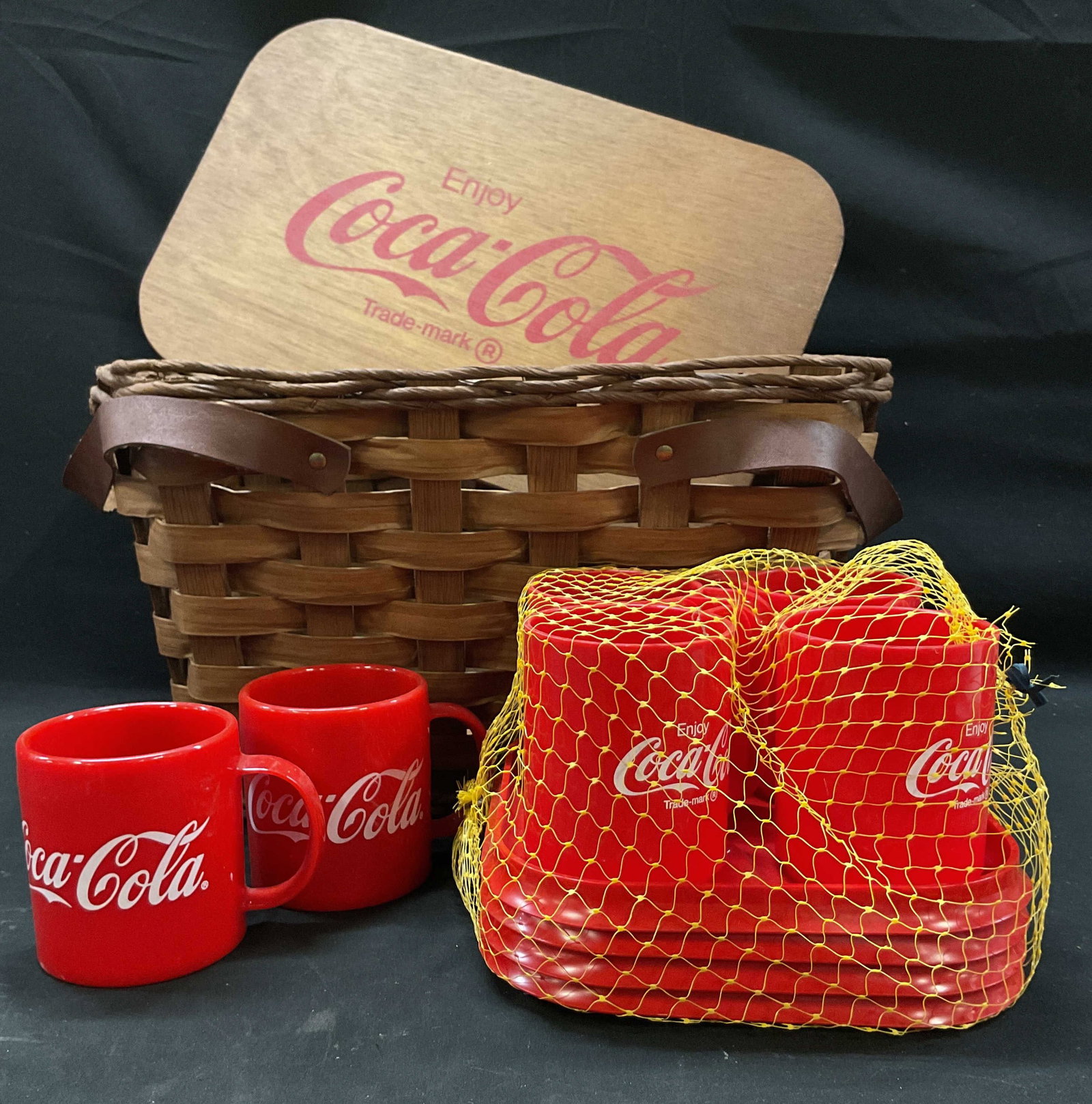 Vtg. 1990s Coca Cola Wicker Picnic Bskt Combo Set: Vintage 1990s Coca Cola Wicker Picnic Basket Combo Set Removable wooden top lid branded Coca Cola script logo. Country style basket woven thick wood splints, accented with two leather side carrying ha