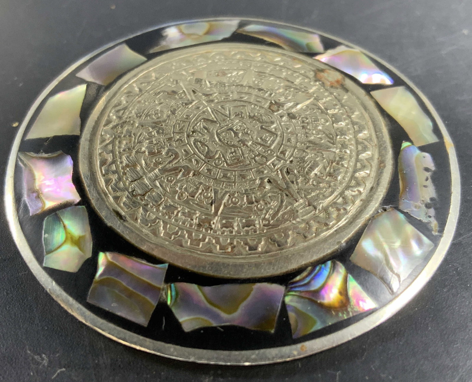 Alpaca Mexico Sterling Brooch: Vintage signed alpaca Mexico Sterling Silver Brooch, featuring abalone shell and circular Aztec Sun Calendar Design, estate jewelry, a blend of Artistica metalwork and shell inlay, measures diameter a