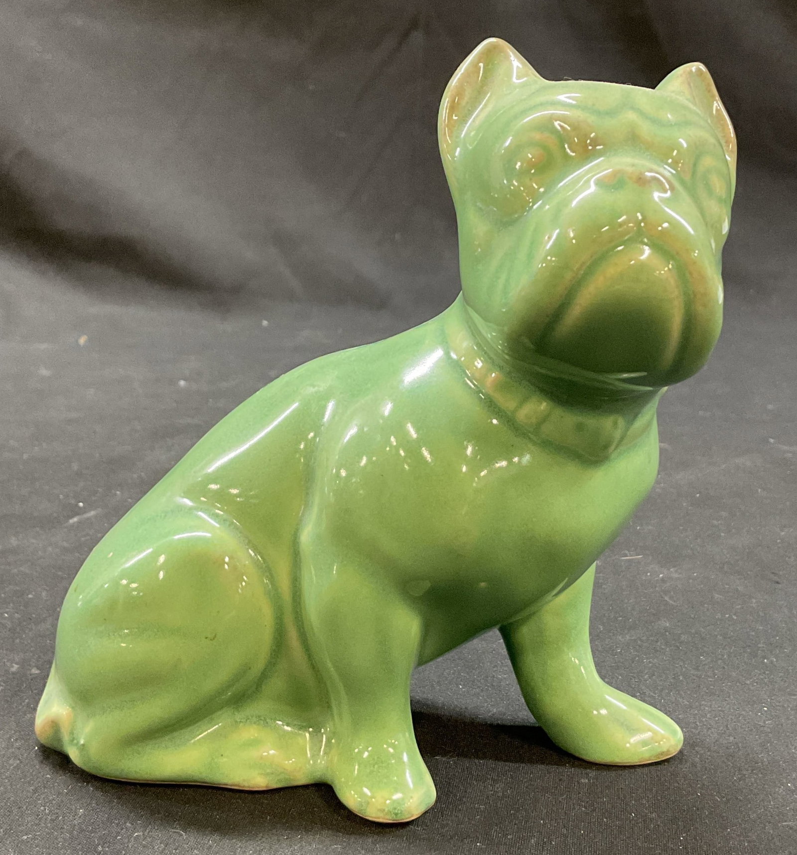 Vintage Green Glazed Ceramic Bulldog Figure: Vintage green glazed ceramic bulldog figure. Sitting bulldog figure. Detailed features and glossy finish. Measures approx 3 x 5 x 5 inches. Surface wear consistent with exposure. Figure, home decor, t