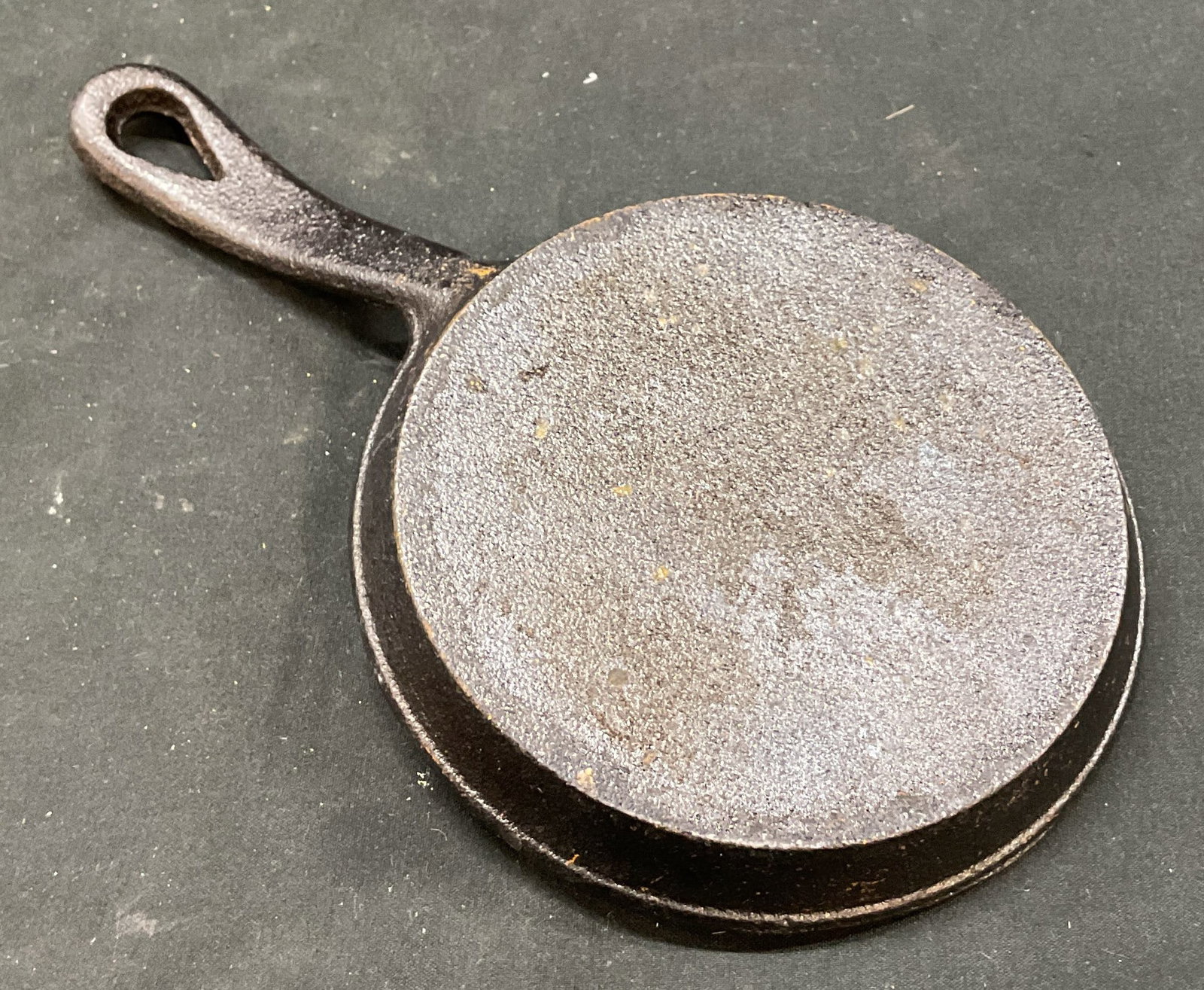Vintage Small Cast Iron Skillet: Vintage small cast iron skillet. Round pan and hole on handle for hanging. No visible markings. Measures approx 5 x 9 inches. Scratching. Skillet, home decor, decor, home accessories, antiques, collec