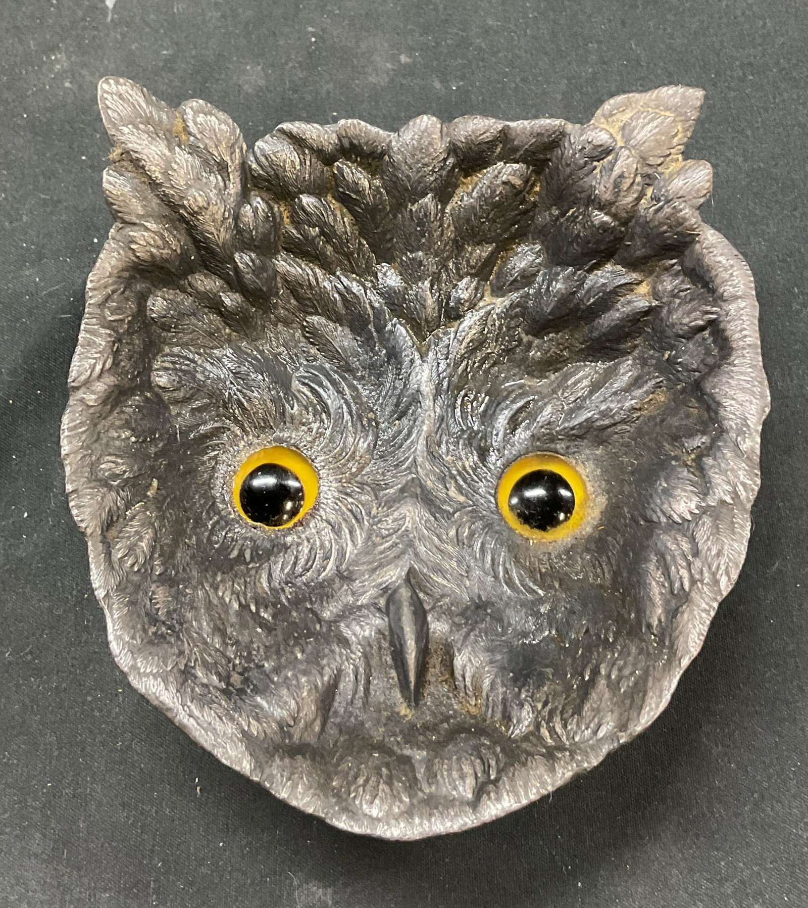 Antique Metal Owl Footed Trinket Dish: Antique metal owl footed trinket dish. Scalloped edge. Shaped like the face of an owl. Detailed feathers and eyes. Short pedestal base. Measures approx 4 x 4.5 x 1.5 inches. Scratching. Trinket dish, 