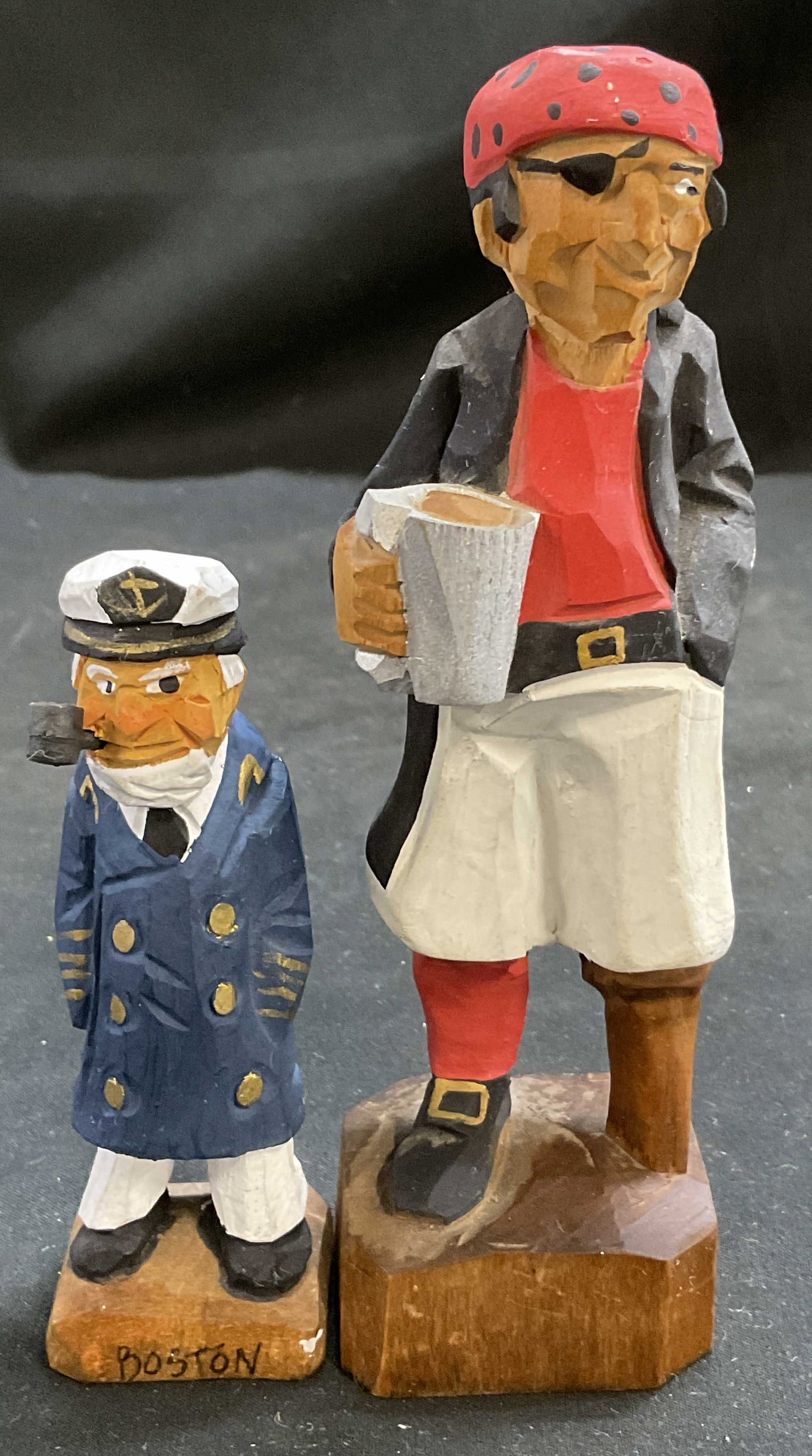 Lt2 VTG Carved&Painted Nautical Figs Nanco, HI: 2 Vintage Circa 1970s-1980s Hand-Carved and Painted Nautical Figurines. One is a Nancy Sales Co Sea Captain Smoking a Pipe with Boston Written on Base. Other is an Intercontinental Traders Pirate