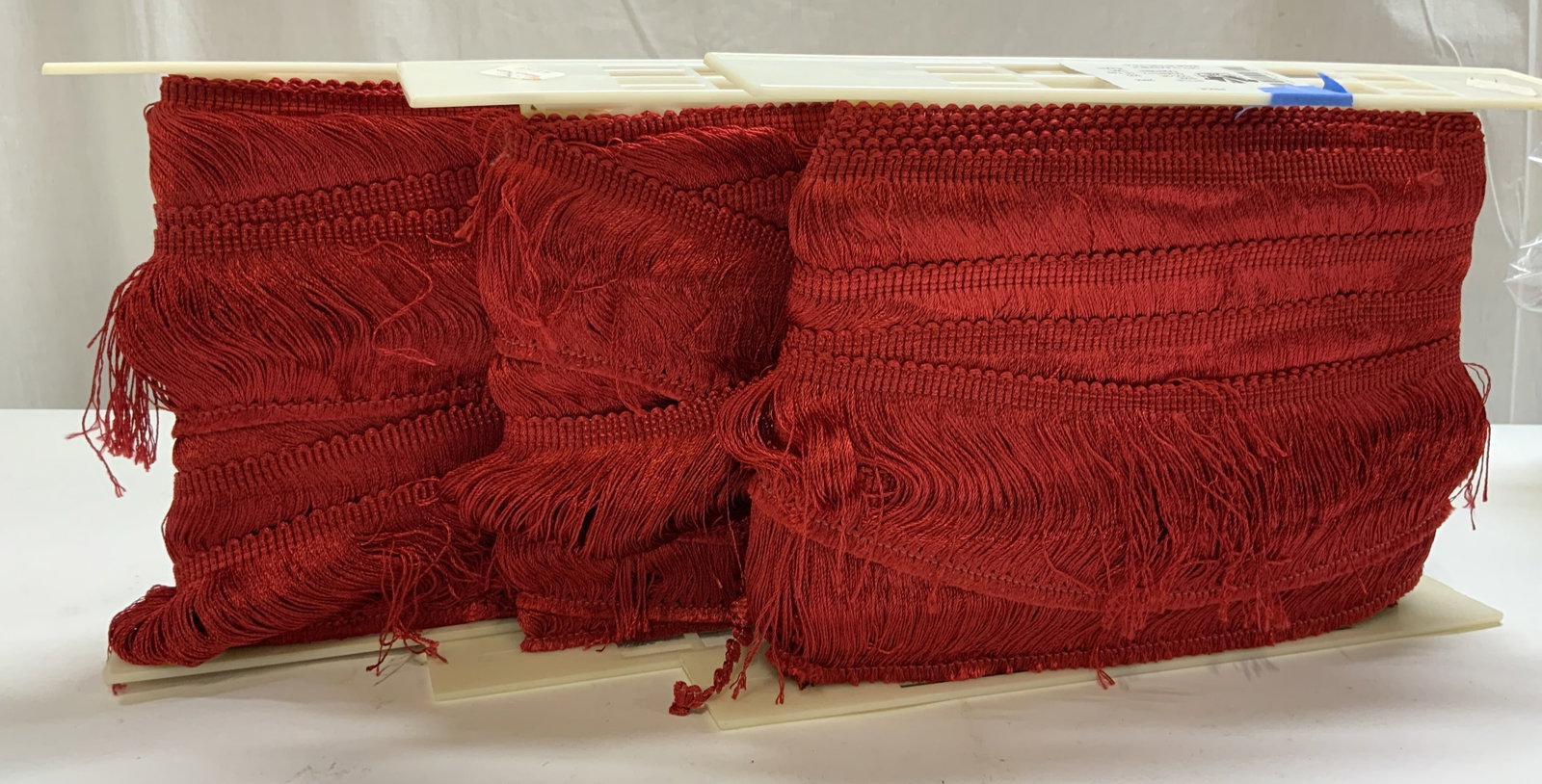 Vtg Lt3 Hollywood Red Bullion Fringe Trim: Vintage Lt 3 Hollywood Trims Red Bullion Fringe Trim. Made in Los Angeles, California. Style 2654. Color 500.100% rayon. Originally 18 Yards Per Roll. Not Unrolled, Measured, or Inspected. Part of a