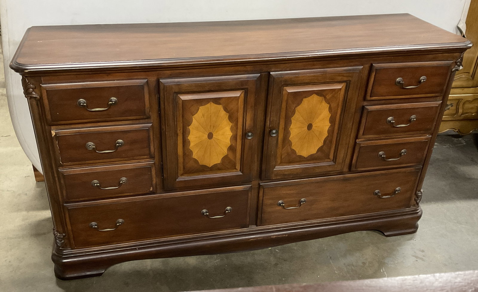 VTG Inlay Cherry Starburst Pattern 7-Drawer Chest: VTG Inlay Cherry Starburst Pattern 7-Drawer Chest. 6 Drawers with Starburst Pattern cabinet that contains a shelves and another drawer. Ornate Acanthus Leaf Carvings. Some scratching consistent with e