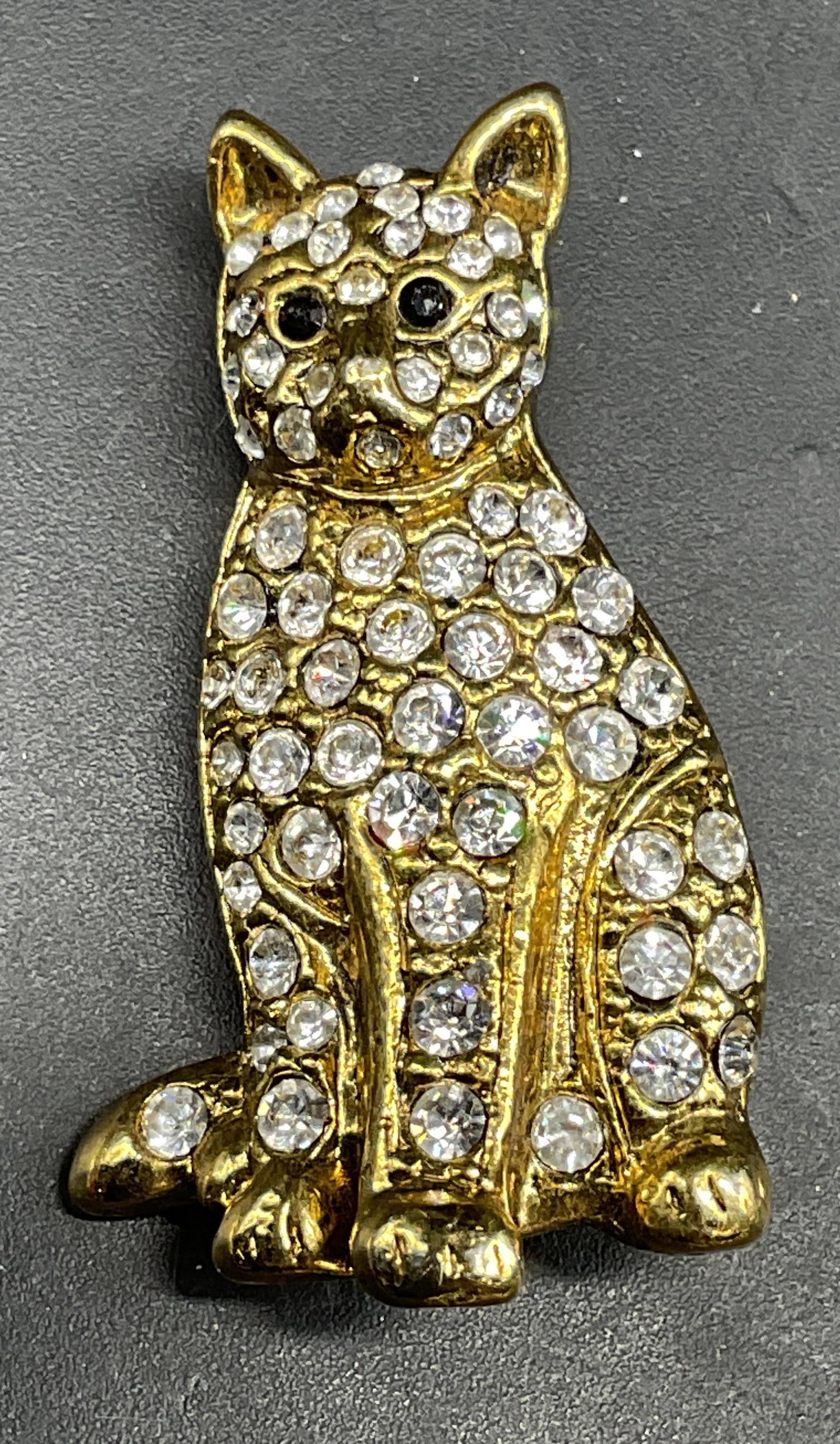 Vintage Gold Tone Crystal Cat Brooch: Vintage gold tone crystal cat motif brooch. Measures approx. 1.5 x 1 inches. Some scratching. Jewelry, estate jewelry, costume jewelry, cocktail jewelry, fashion jewelry, accessories, fashion accessor