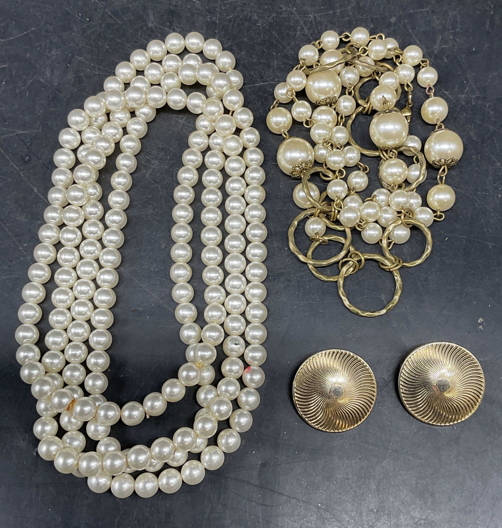 Lot 3 Faux Pearl Necklaces & Gold Tn Earrings: Lot of 3 vintage jewelry pieces. Faux pearl necklace, faux pearl and gold tone necklace, gold tone disc earrings. Longest necklace drop length 27.5 inches. Earrings measures approx. 1.25 inches wide.