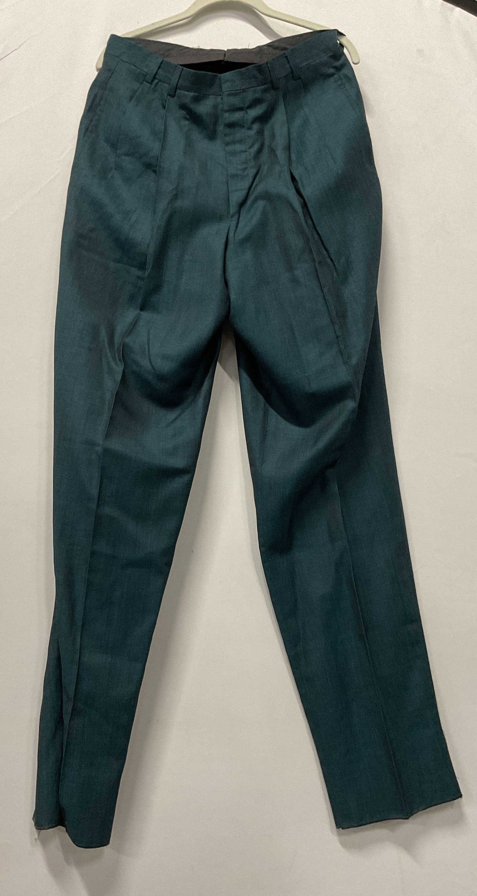 Jhane Barnes teal dress pants: Jhane Barnes teal dress pants. Made from a wool linen blend and in Italy. Size 32. Never been worn partial tag still attached. Bottom right leg slight fraying. Ripped on the back waistband. Dress