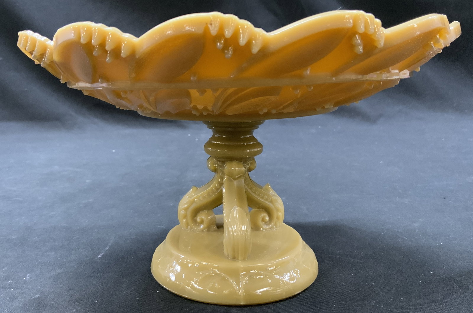 Vtg Imperial Glass Holly Compote Bowl c.1950s: Vintage Imperial Glass Holly pattern Caramel slag glass pedestal compote bowl scalloped candy dish. Circa 1950s. Interior basin smooth, glossy for displaying candies or trinkets. Underside of bowl sty