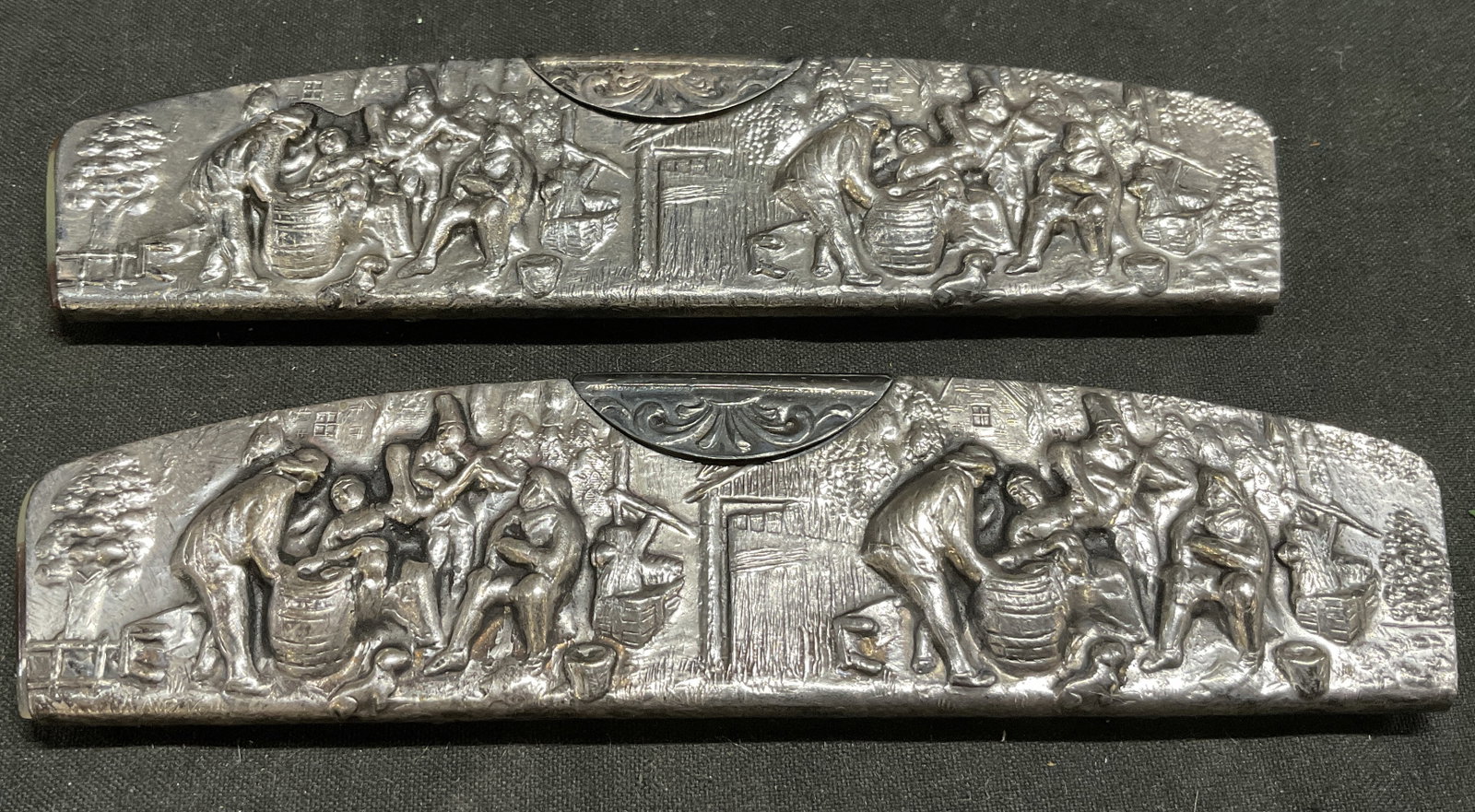 Lt2 VTG DUTCH Silver-Plated Pocket Comb Holders: 2 Vintage Dutch Silver-Plated Pocket Comb Holders. Features Detailed Repousse Dutch Tavern Scene on Sheaths. Comes with Original Faux-Tortoiseshell Combs. Tarnishing Present. Measures app 1.25in H x 4