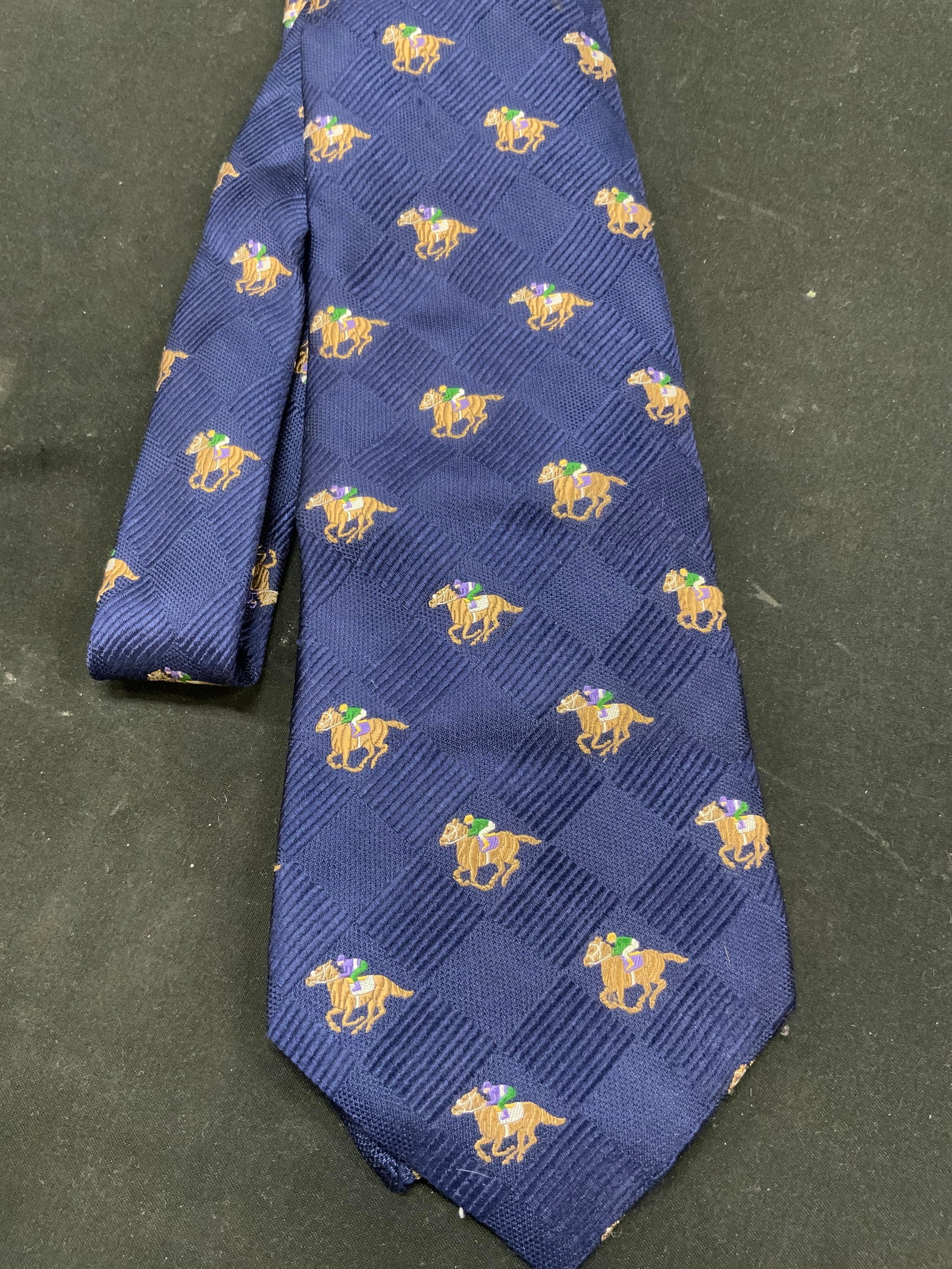 Vtg Michelsons Silk Horse Racing Necktie, UK&USA: Vintage Michelsons 100% silk Equestrian horse racing mens necktie. Made in USA, Fabric constructed in London. Navy blue ground woven with textured block and stripe geometric jacquard pattern. All over