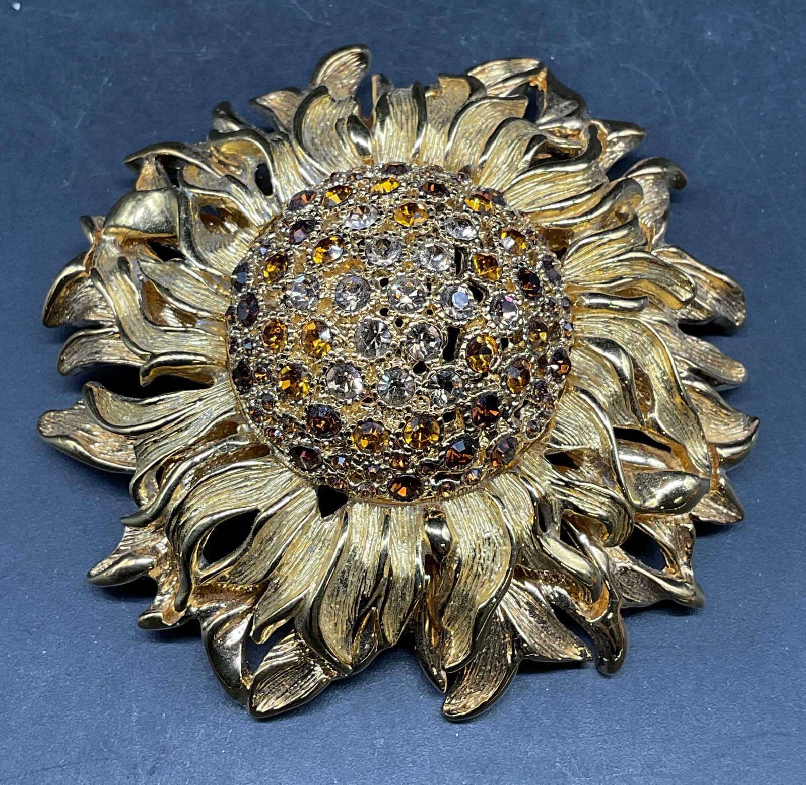 Vintage Monet Crystal Flower Statement Brooch: Vintage signed Monet gold tone flower statement brooch with crystal decoration. Measures approx. 2.5 inches wide. Some scratching. Jewelry, estate jewelry, costume jewelry, cocktail jewelry, fashion j