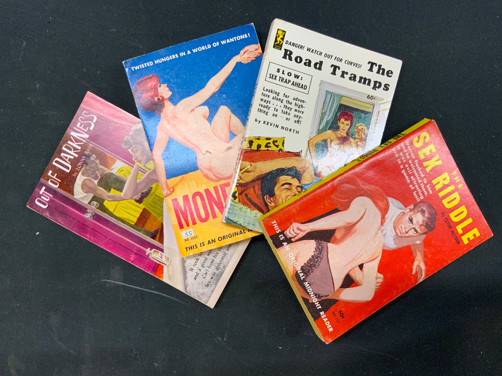 Lt4 Vtg 1960s Erotica/Sleaze Pulp Books: Lot of 4 Vintage 1959-1963 Erotica/Sleaze Pulp Books. Includes 1x Out Of Darkness by Lonny Bass. Published 1959 by Saber Books. 1x Money Bed by Clyde Allison. Published 1963 by Nightstand Books. 1x