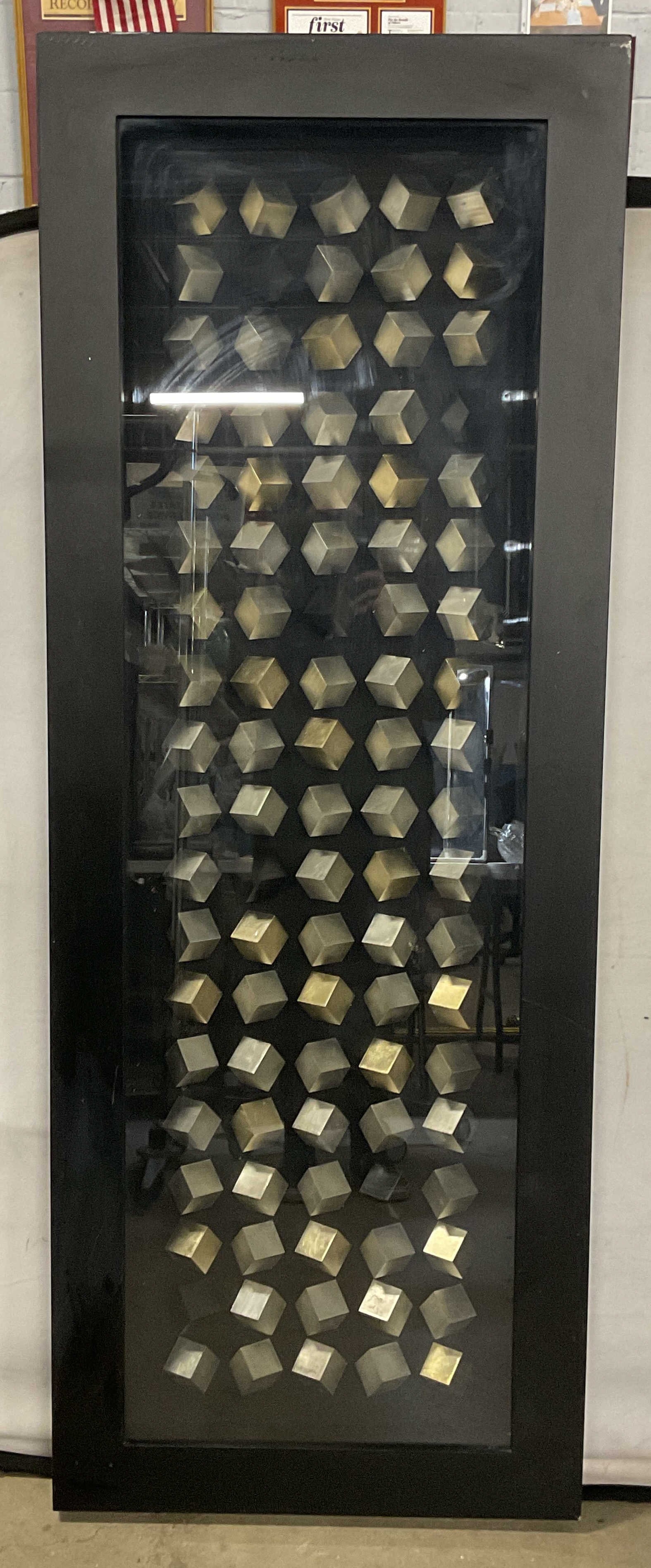 Z Gallerie Framed Modernist Silver Cubes 63in: Shadow box framed modernist wall art. Silver tone cubes. Z Gallerie label on verso. Black wood frame. Not examined out of frame. Frame measures approx. 63 x 23.5 inches. Piece has significant weight. 