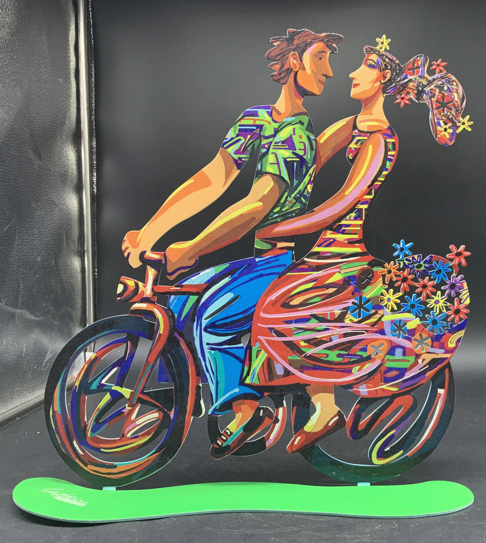 GERSTEIN, bicycle Riders Steel Sculpture: Steel Metal Sculpture by David GERSTEIN, titled Spring Bicycle Riders, laser cut sculpture featuring a colorful pop art design of a couple riding a bicycle together, hand painted on both sides and con