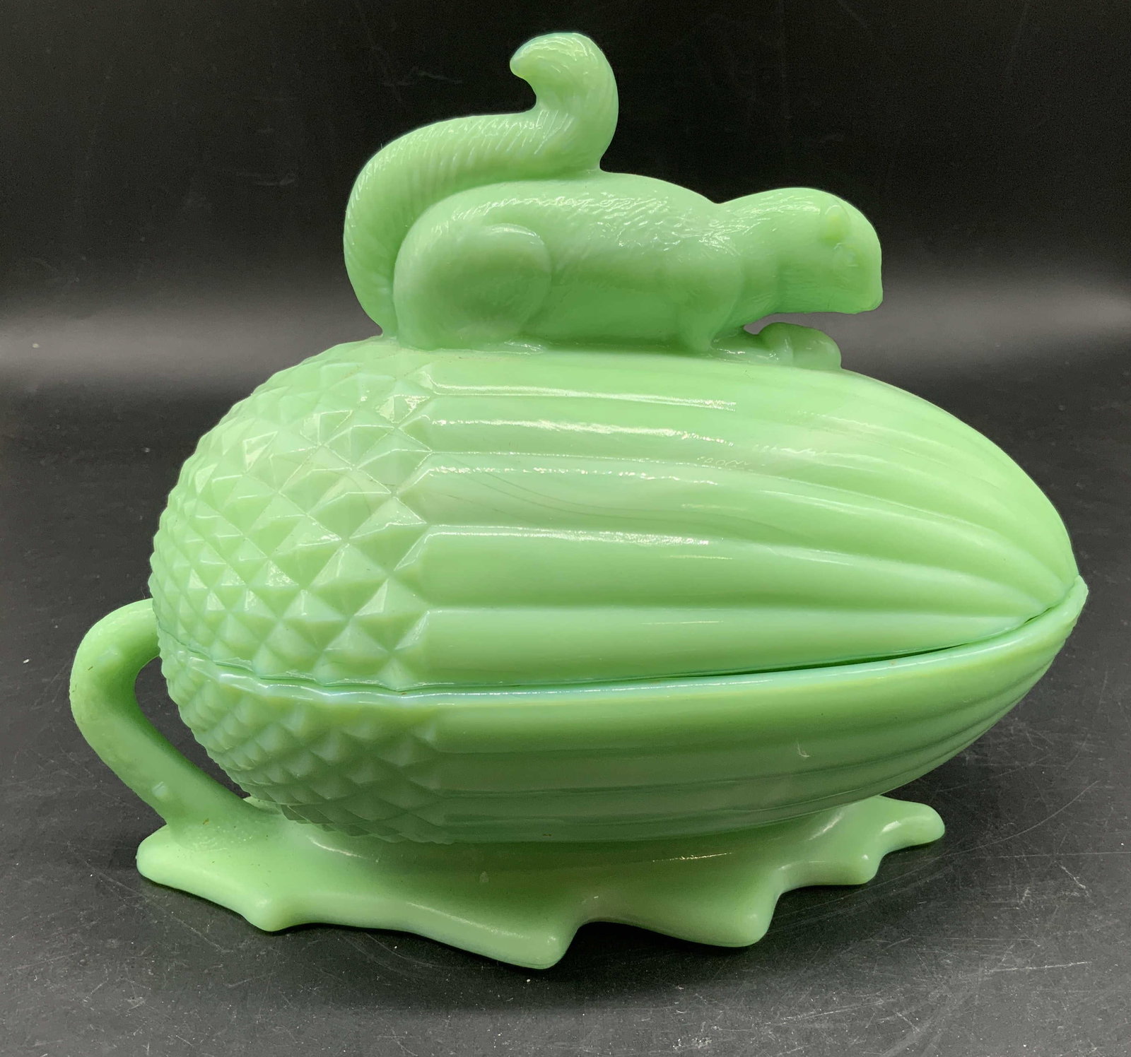 Vntg Martha Stewart Jadeite Squirrel Dish: Vintage Martha Stewart Jadeite Squirrel and Acorn Covered Dish, features a light green translucent glass color, jadeite, and measures approximately 8 inches long by 6.25 inches ht, circa 1990s, collec