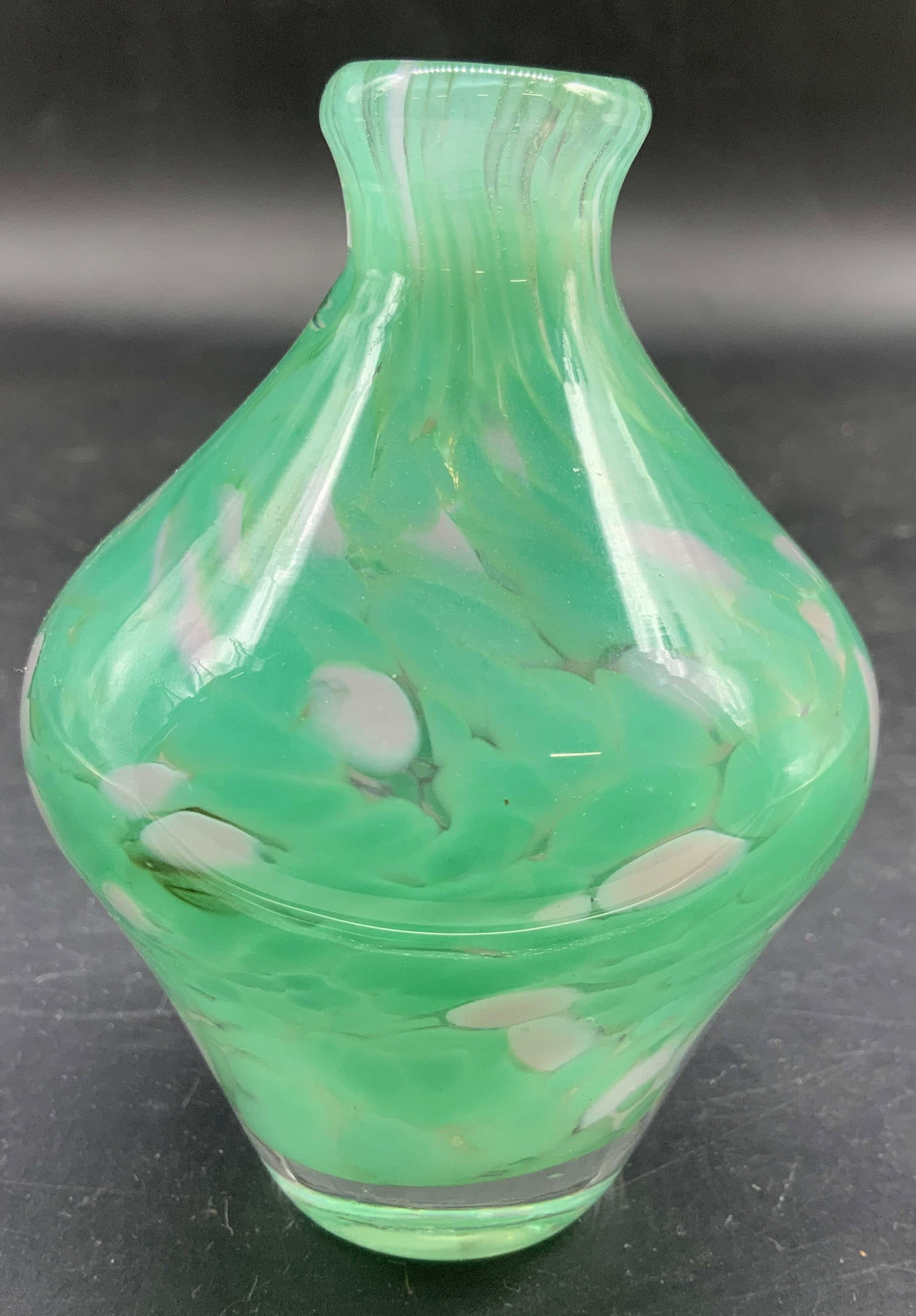 Signed Green White Confetti Art Glass Vase: Vintage hand blown , signed and dated on underside illegibly, Art Glass Vase, thick walled, in a bright green and white splatter and confetti design , accented with swirls through out the glass, vinta