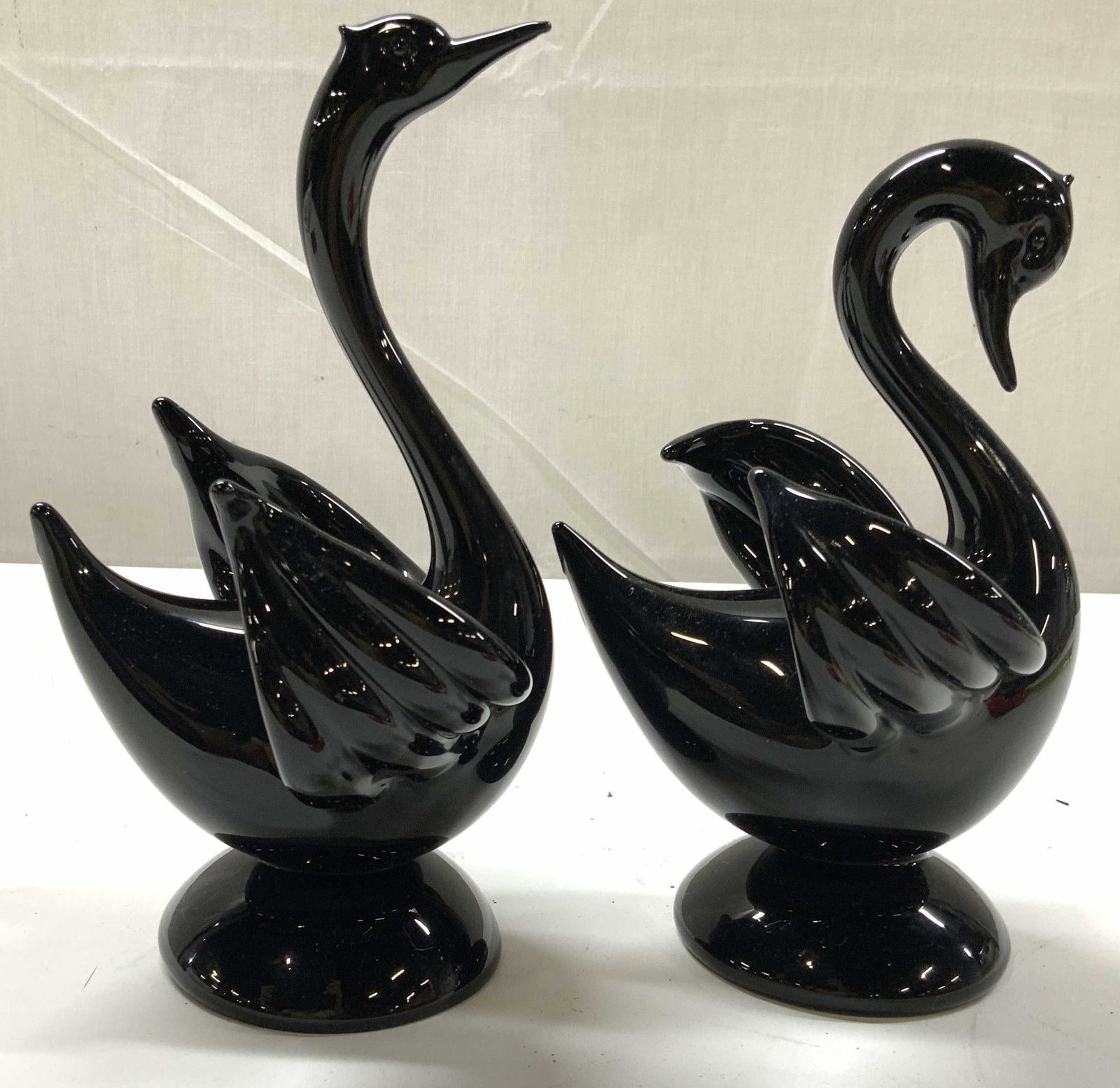 Pair Black Murano Glass Swans, Italy: Pair of Black Murano art glass swans, made in Italy, labels affixed to underside, taller measures ht 8.5 inches, length 5 inches, depth 5 inches, art glass, Italian art glass, swan figurals, s