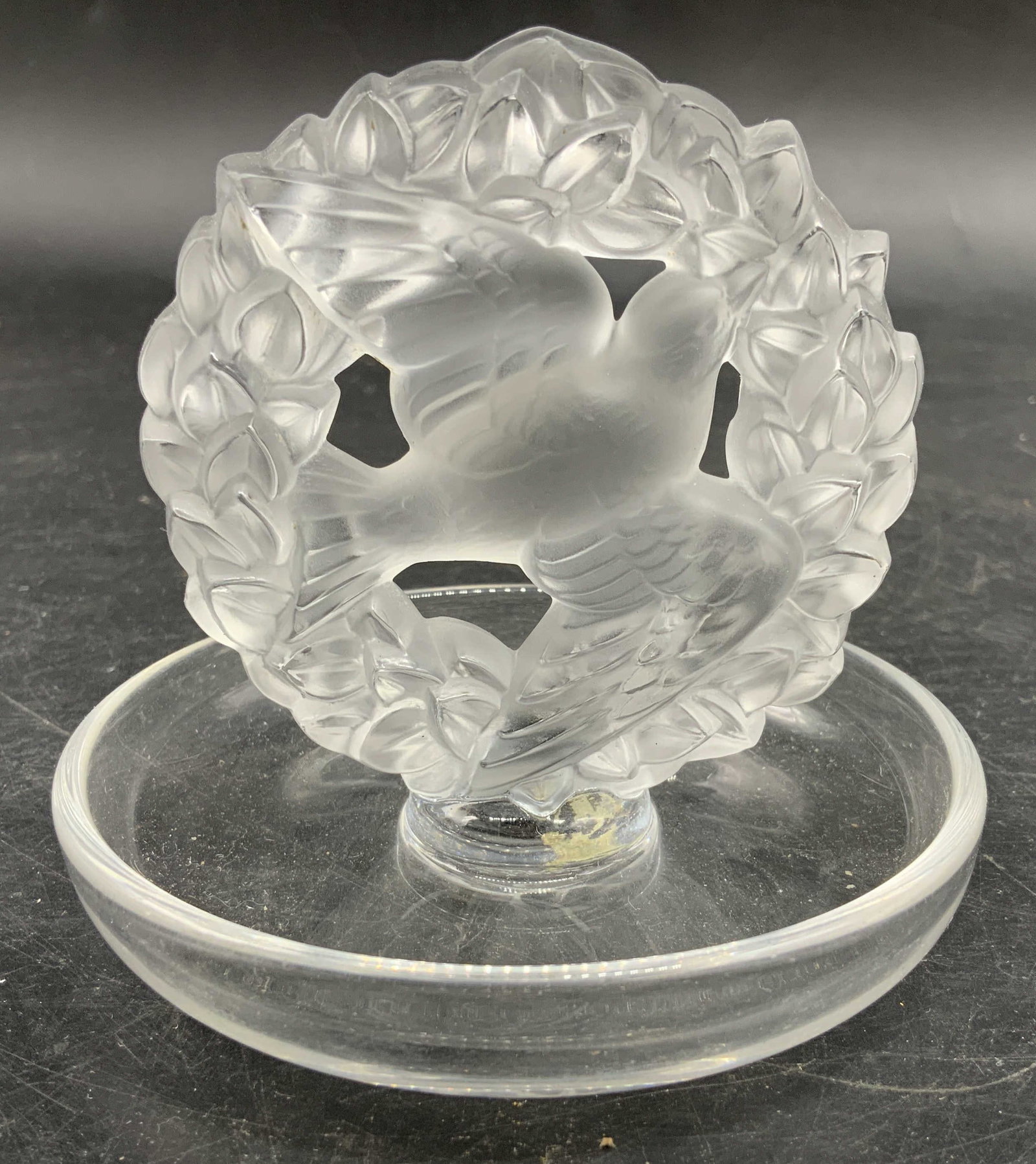 Lalique France Crystal Ring Dish w Dove: Lalique, France Crystal Ring Dish featuring a frosted Dove of Peace nestled within a botanical wreath, measures ht app 4 inches diameter app 4 inches, LC