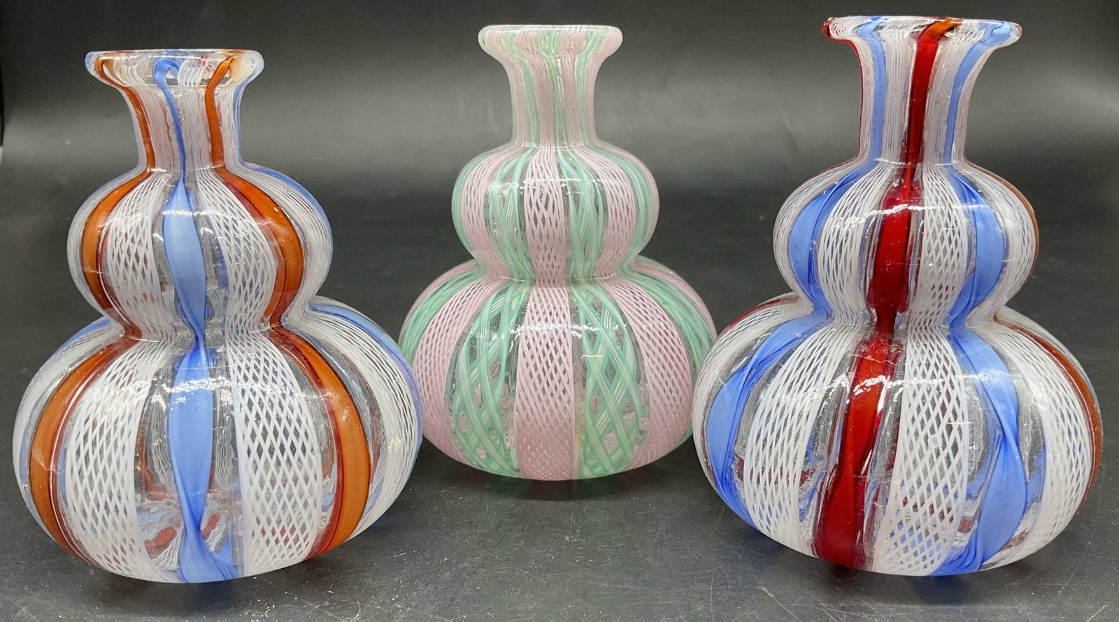 Grp 3 Vintage Murano Latticino Vases, Italy: Group 3 vintage MURANO Italian art glass bud vases featuring a double gourd shape and Zanfirico Latticino ribbon design , each measures ht app 4.25 inches diameter app 3 inches, Italian art glass,