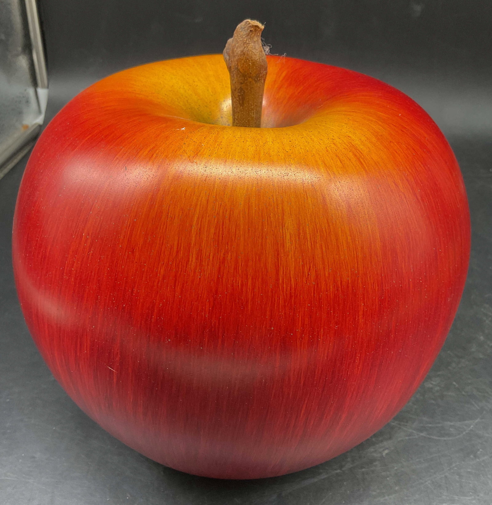 Lg Hand Painted Ceramic Apple Figural: Large hand painted ceramic apple figural with blended reds and orange yellow tones, short wooden stem, measures ht app 9 inches, diameter app 8 inches, decorative object, folk art apple