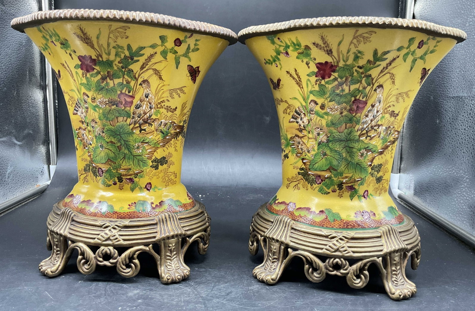Pr Chinoiserie Panted Ceramic Vases Br Mounts: Pair of Chinese Chinoiserie Vases feature intricate floral and bird motifs on a vibrant yellow ground adorned with bronze toned mounts, signed underside with Asian characters, each measures ht app 10 