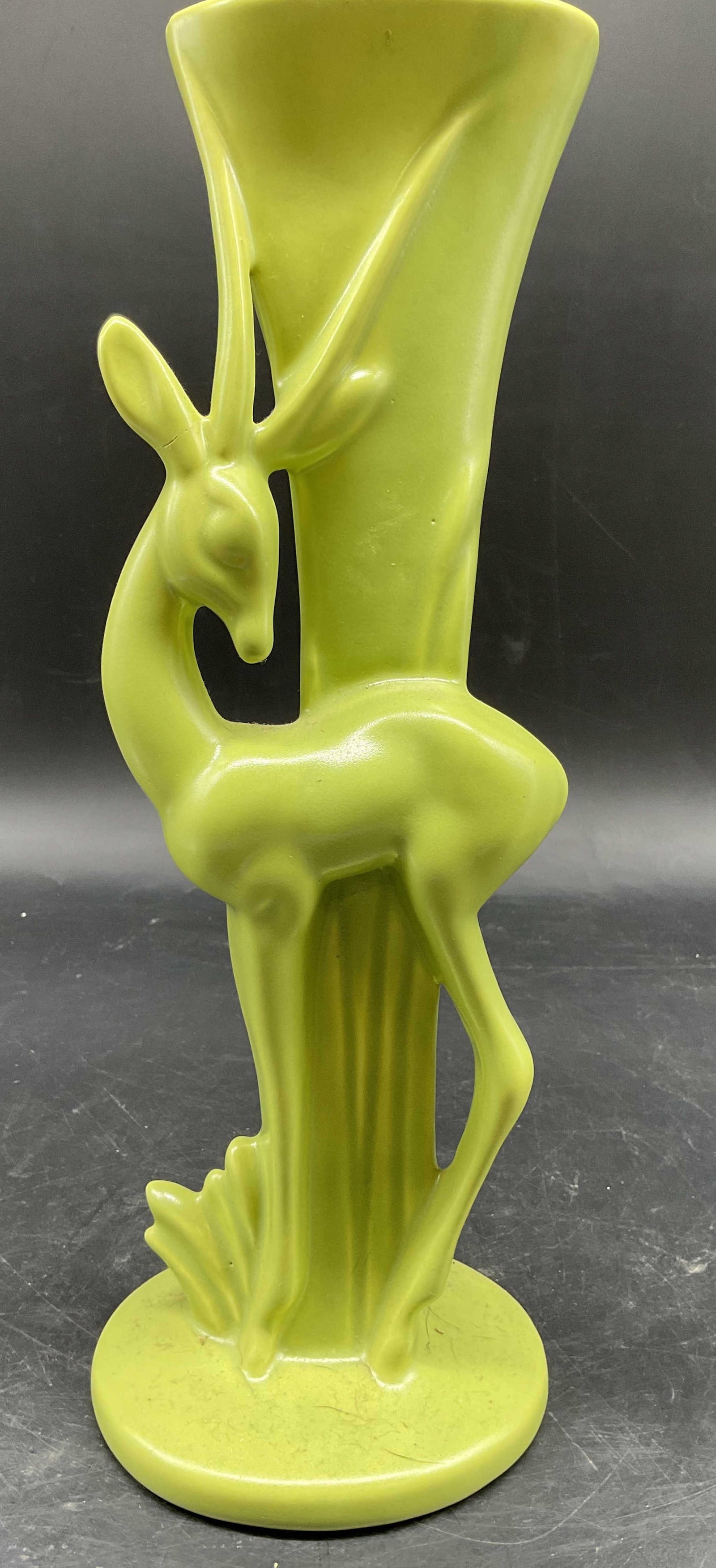 Royal Haeger Chartreuse Gazelle Vase C1940s: Royal Haeger Chartreuse Gazelle Vase, iconic piece of mid century art pottery featuring a slender gazelle alongside a minimalist easel, measures ht app 12 inches, width app 4.5 inches, depth app 5