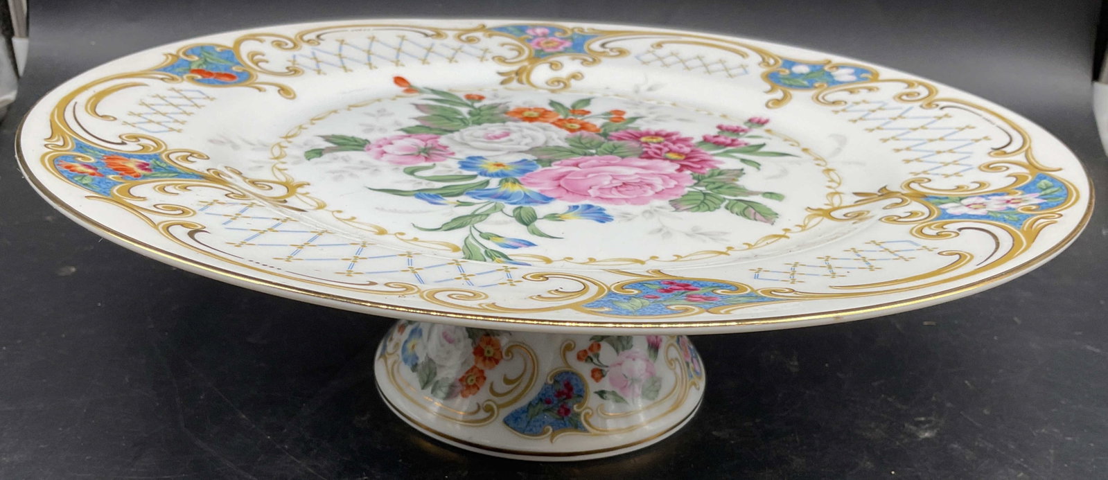 Vintage Porcelain Floral Cake Stand: Vintage Porcelain Floral Cake Stand, florals , geometrics, scrolls and lattice work, tones of pinks, aquas and golds, measures, ht 3.75 inches diameter app 10.75 inches