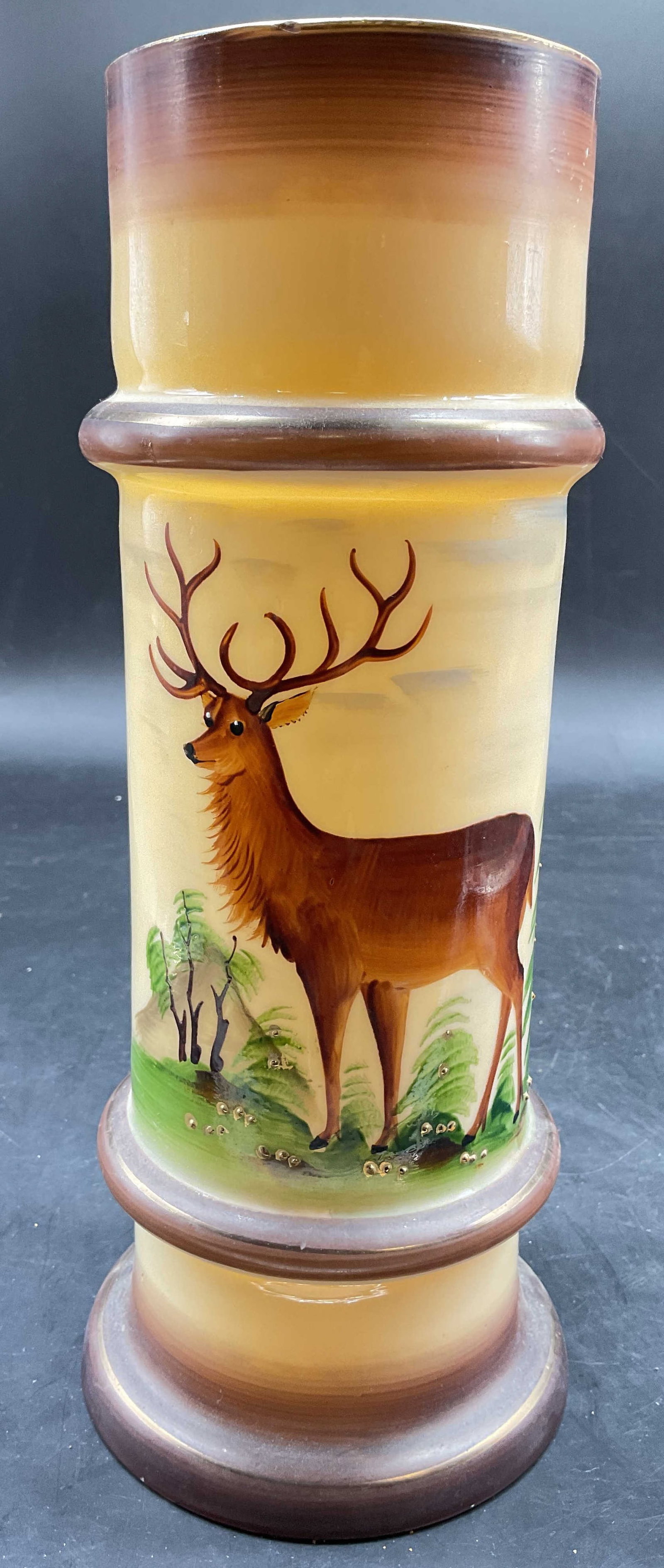 Vntg Hand Painted Deer Opaline Vase: Vintage mid century hand painted porcelain cylindrical vase, featuring a hand painted deer w horns in a Forrest setting, accented with gold dots of paint, measures ht app 11 inches, diameter app 4.5