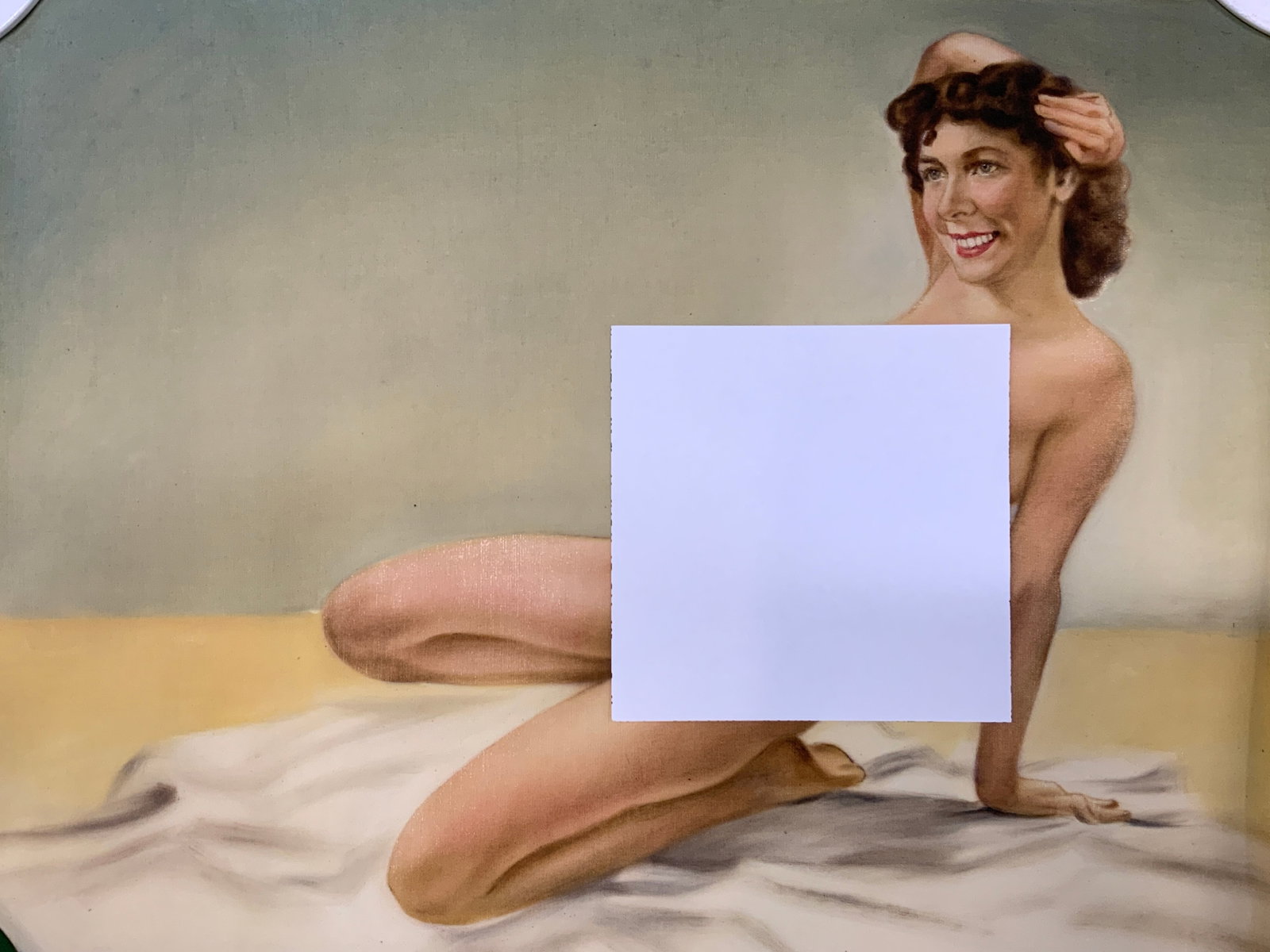 Vtg c.1940s Nude Pinup Hanging Scroll Print: Vintage circa 1940s pin-up calendar print. Reclined nude model on beach scene. Brunette woman with mid century hairstyle smiling towards viewer, posed against seaside backdrop composed of sand, water,