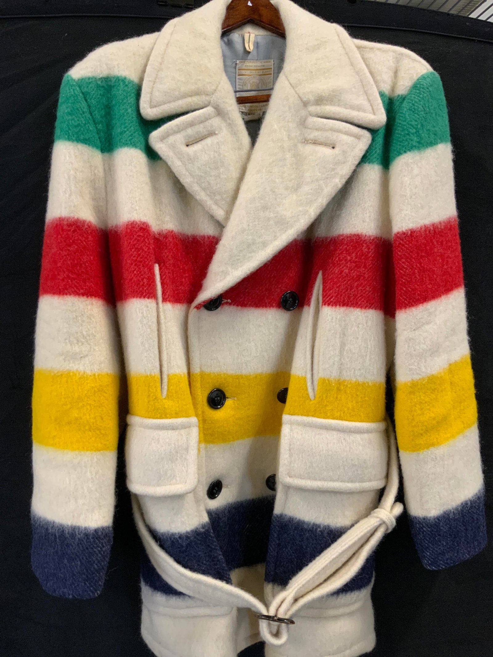 Hudson Bay striped wool coat, Canada: Hudson Bay coat. Made from 100% genuine wool in Canada. Cream colored coat with colorful stripes. Double breasted button closure. Belted and 4 front pockets. Lining stained. Wool coat, Canada, Hudson 