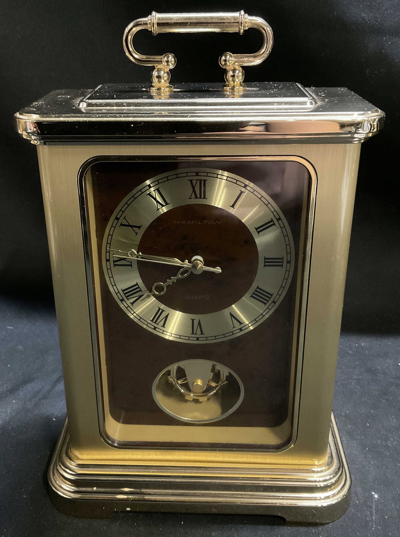VTG Hamilton Brass-Toned Quartz Carriage Clock: Vintage Hamilton Brass-Toned Carriage Clock. Japan. Battery Operated Quartz Movement. Condition Consistent with Exposure. Not Tested for Functionality. Measures app 9in H x 5.5in Diam. Vintage Clocks,
