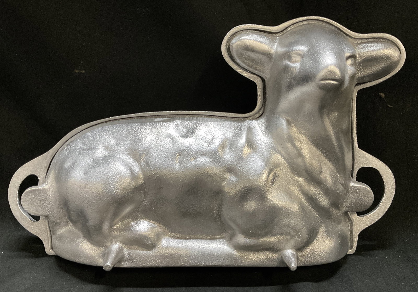VTG Kitchen Supply USA Aluminum Easter Lamb Mold: Vintage Circa 1980s-1990s Kitchen Supply USA Two-Piece Cast Aluminum Easter Lamb Baking Mold. Shaped Like Reclining Lamb, Featuring Side Tabs to Secure the Mold with Clips During Baking. Condition Con