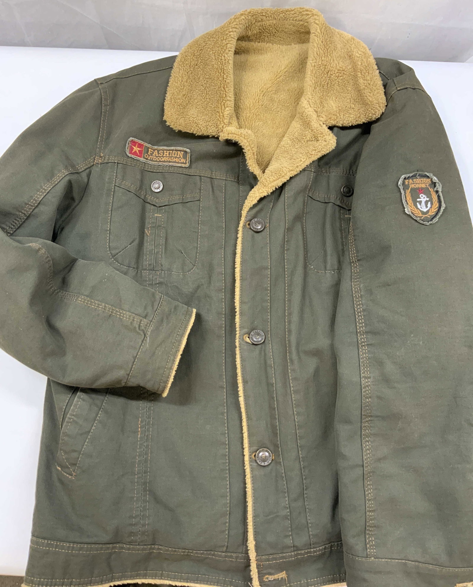 Vntg FASHION bomber jacket with faux fur lining: Vintage FASHION bomber jacket in olive green. Jacket features embellished patches on the chest and sleeve . The chest patch reads fashion, outdoor fashion with a red star. The sleeve patch reads fashi
