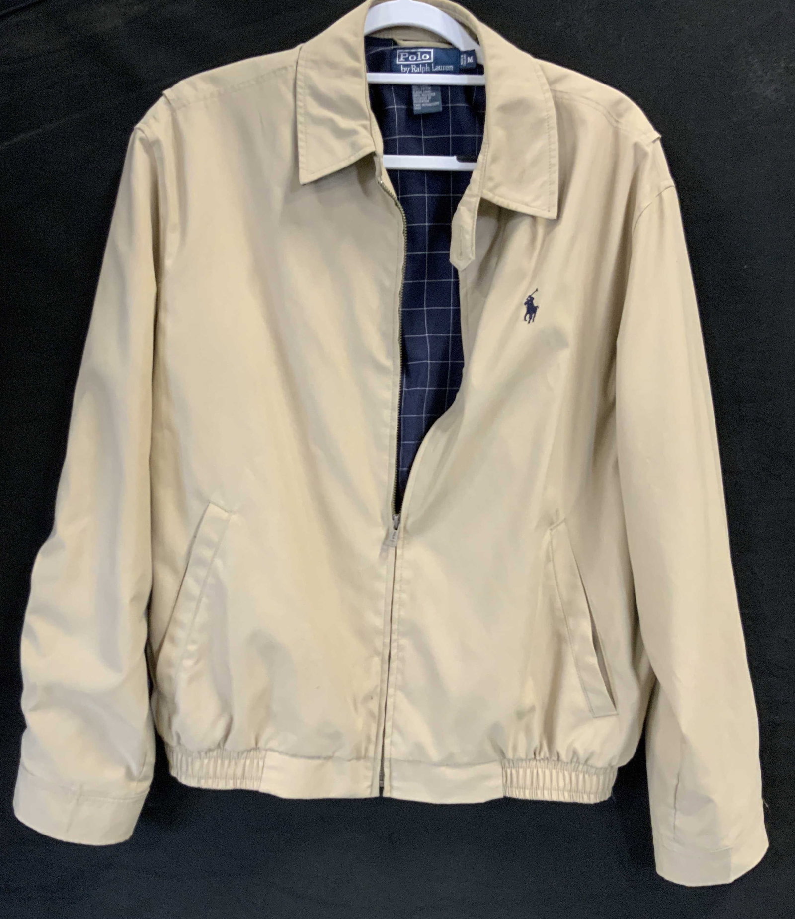 Vntg Ralph Lauren Harrington Jacket: Vintage Ralph Lauren Harrington Jacket. Made of 100% polyester exterior and 100% cotton lining. Featuring signature embroidered pony logo on front chest. Beige khaki color with contrasting navy blue c