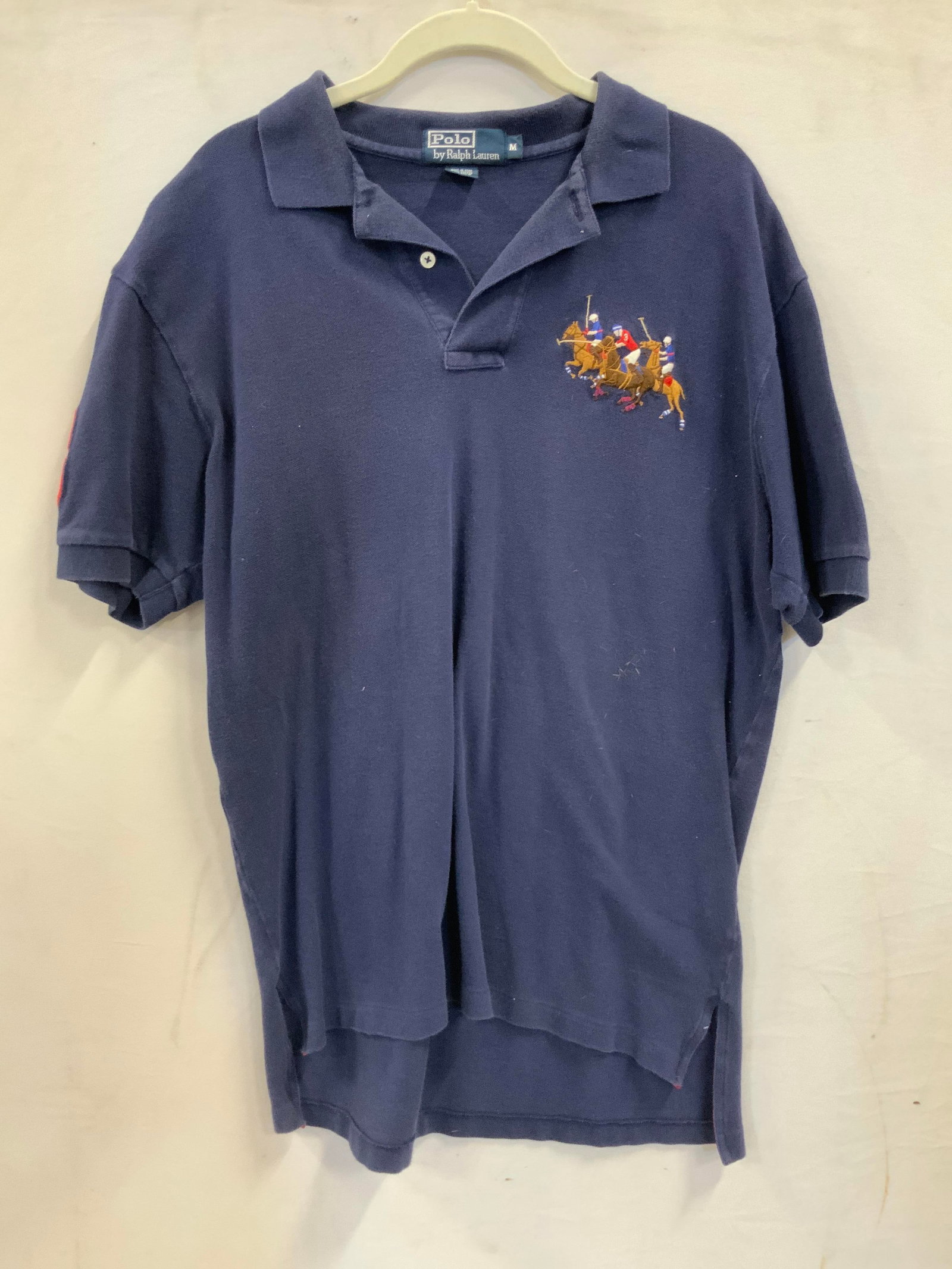 Vntg Ralph Lauren triple pony polo shirt.: Vintage Ralph Lauren triple pony polo shirt. Made of 100% cotton, made in Peru. Shirt features a vintage triple pony Polo by Ralph Lauren embroidered logo on the chest. Also a red number 3 applique on
