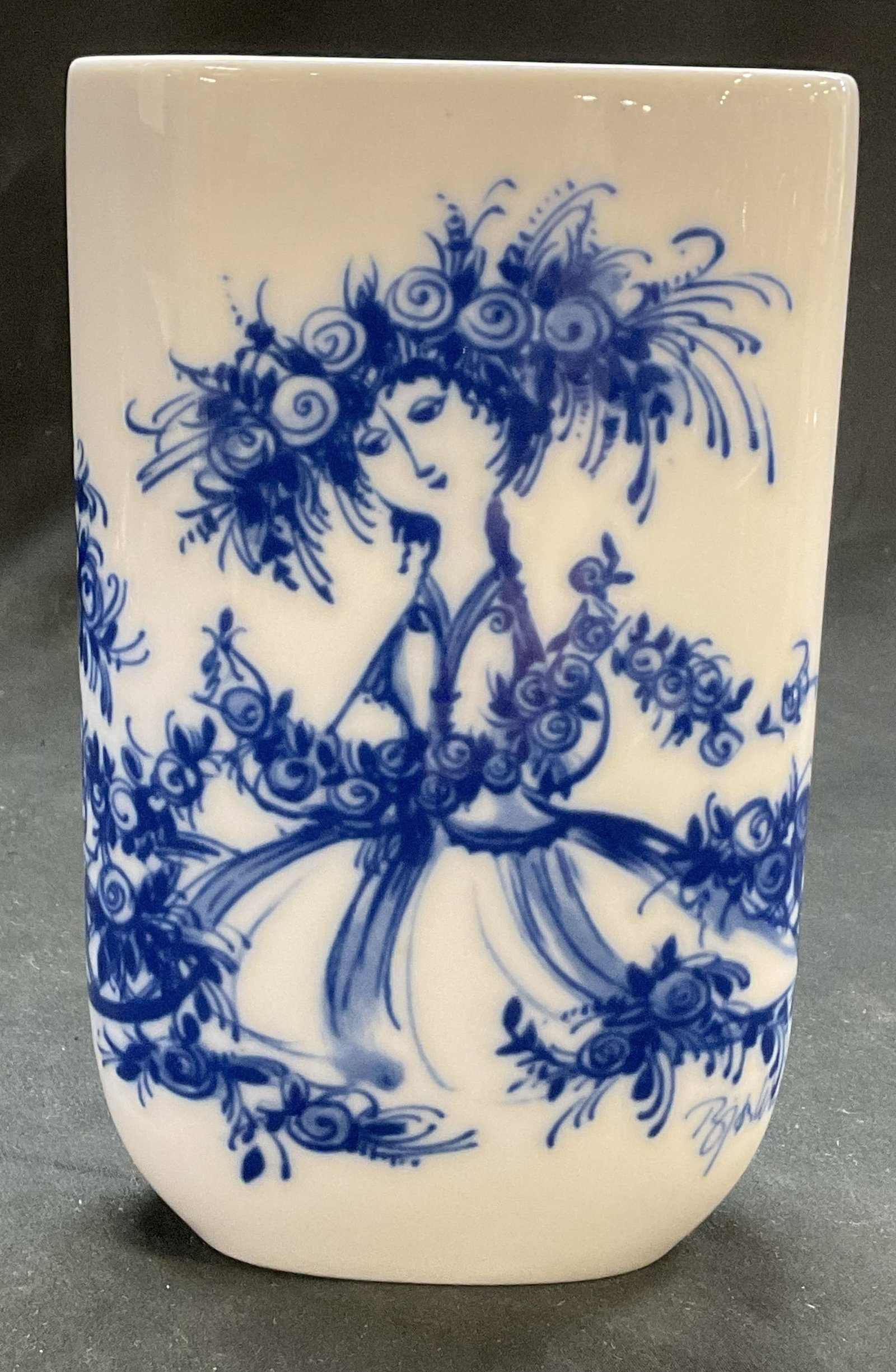 Rosenthal Studio Linie Wiinblad Vase Germany: Rosenthal Studio Linie porcelain vase. Marked on underside, made in Germany. Oval shaped. Blue and white design of a woman figure with flowers in her hair, by Bjorn Wiinblad. Measures approx 2 x 4.5 x