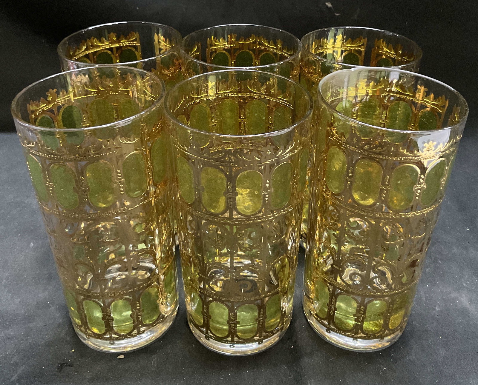 Set6 VTG Culver Ltd Gilt Filigree Highball Glasses: Set of 6 Vintage Culver Ltd Gilt and Green Filigree Design Highball Glasses. Scratching and Fading Present. Chip on Rim of One. Measures app 6in H x 2.75in Diam. Vintage Highball Glasses, Culver Ltd, 
