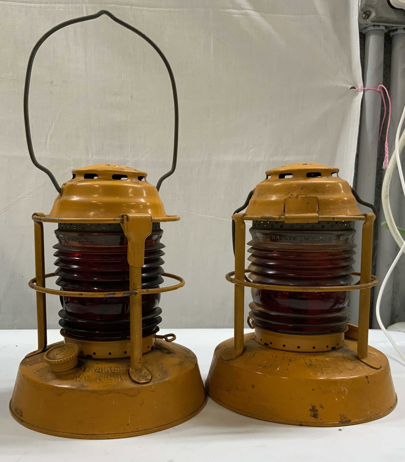2 Vntg DIETZ Night Watch lanterns 1950s USA: Set of 2 vintage DIETZ Night Watch kerosene lanterns. Used in the 1950s manufactured in Syracuse, NY. Industrial railroads warning hazard lights. Featuring ribbed red Fresnel glass globes and steel ba