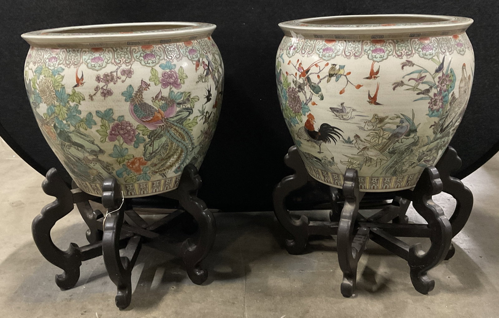 Pair VTG Chinese Famille Rose Porc Jardinieres: Pair of Vintage Chinese Famille Rose Porcelain Jardinieres on Carved Wooden Stands. White and Beige with Colorful Overglaze Enamel Decorations Featuring Stylized Peacocks, Exotic Birds, and Rich Flora