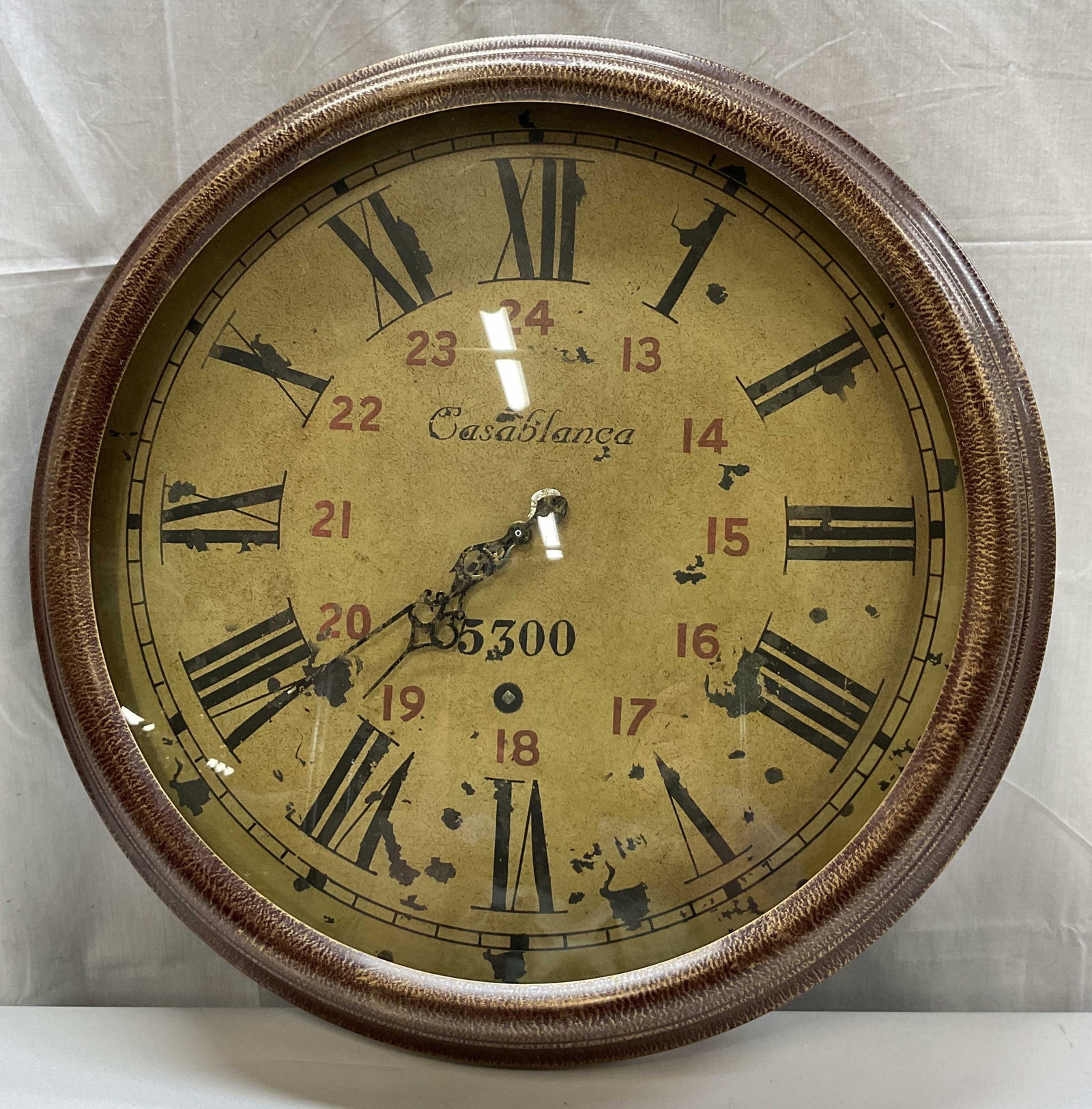 Vintage Casablanca 5300 Round Wall Clock: Vintage Casablanca 5300 metal round wall clock. Brown textured design frame. Features Roman numerals. Measures approx 27 inches in diameter. Not tested for function, sold as is. Surface wear consisten