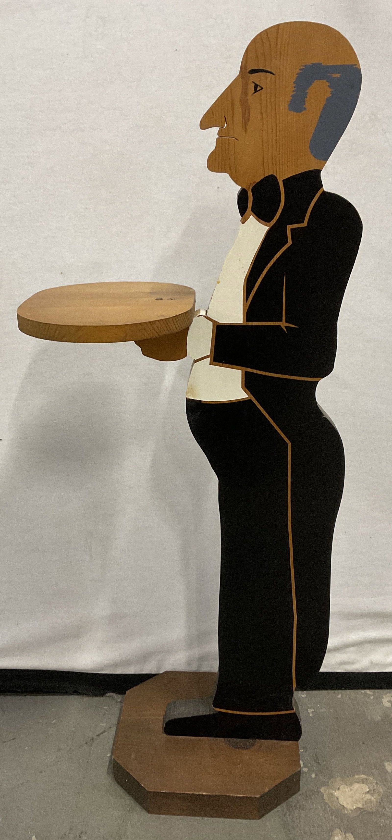 VTG Handcrafted Wooden Butler Dumbwaiter Stand: Vintage Handcrafted Wooden Butler Dumbwaiter Tray Stand. Hand-Painted Tuxedo. Natural Wood Grain on Face, Tray, and Stand. Some Scratching. Measures app 38in H x 16in L. Vintage Decor, Handcrafted, Wo